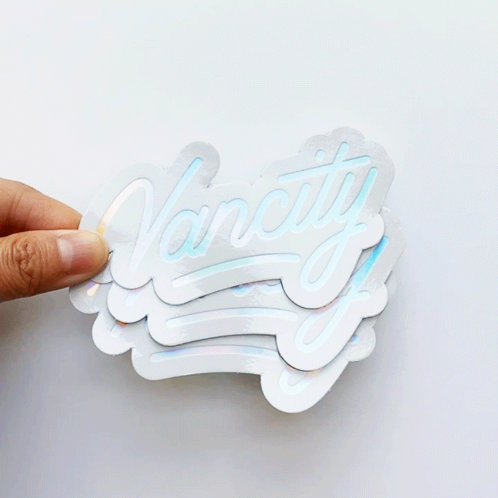 Vancity-Sticker_HoloOnWhite-Reflective.gif