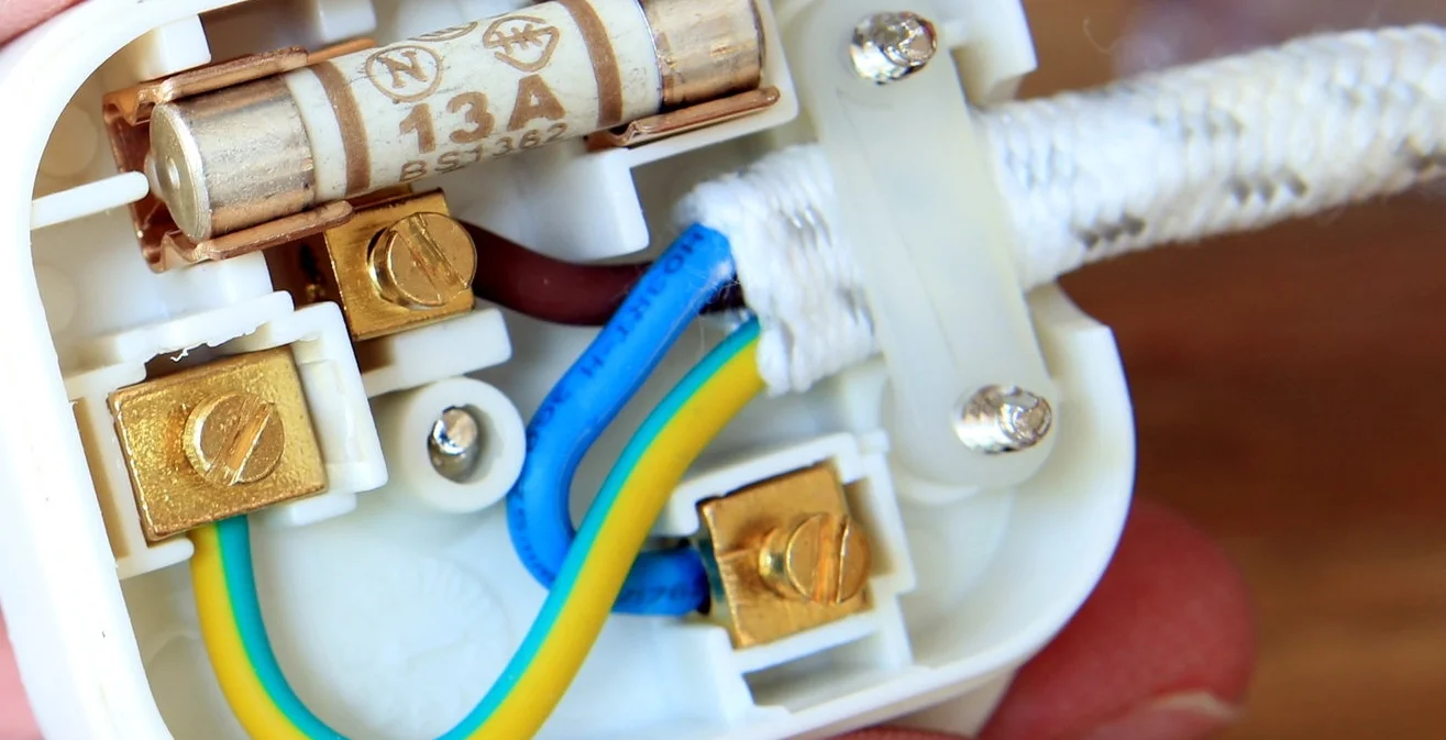 UK 13 amp domestic electric plug with back taken off to change t