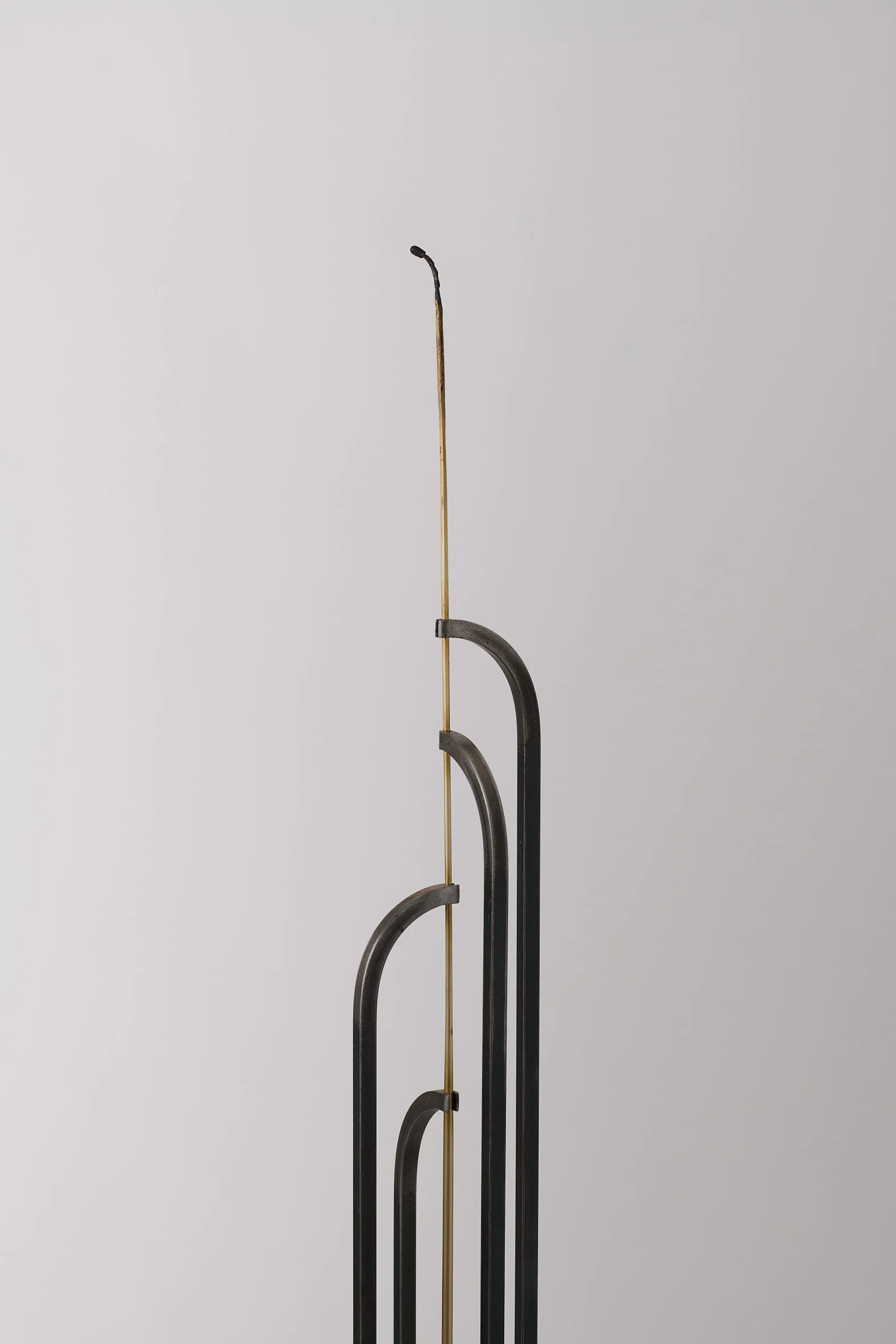   Charred, but held , 2025 (detail) bronze, brass, mild steel 131 × 11 × 11 cm 