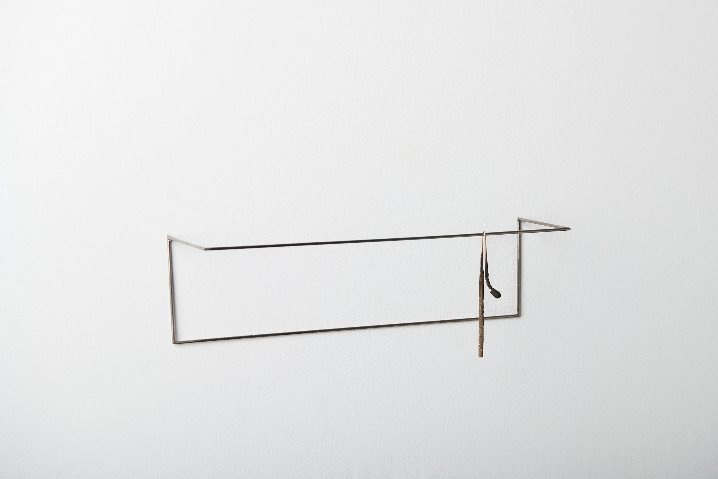   Slumped match , 2025 bronze, stainless steel 10 × 30 × 8 cm 