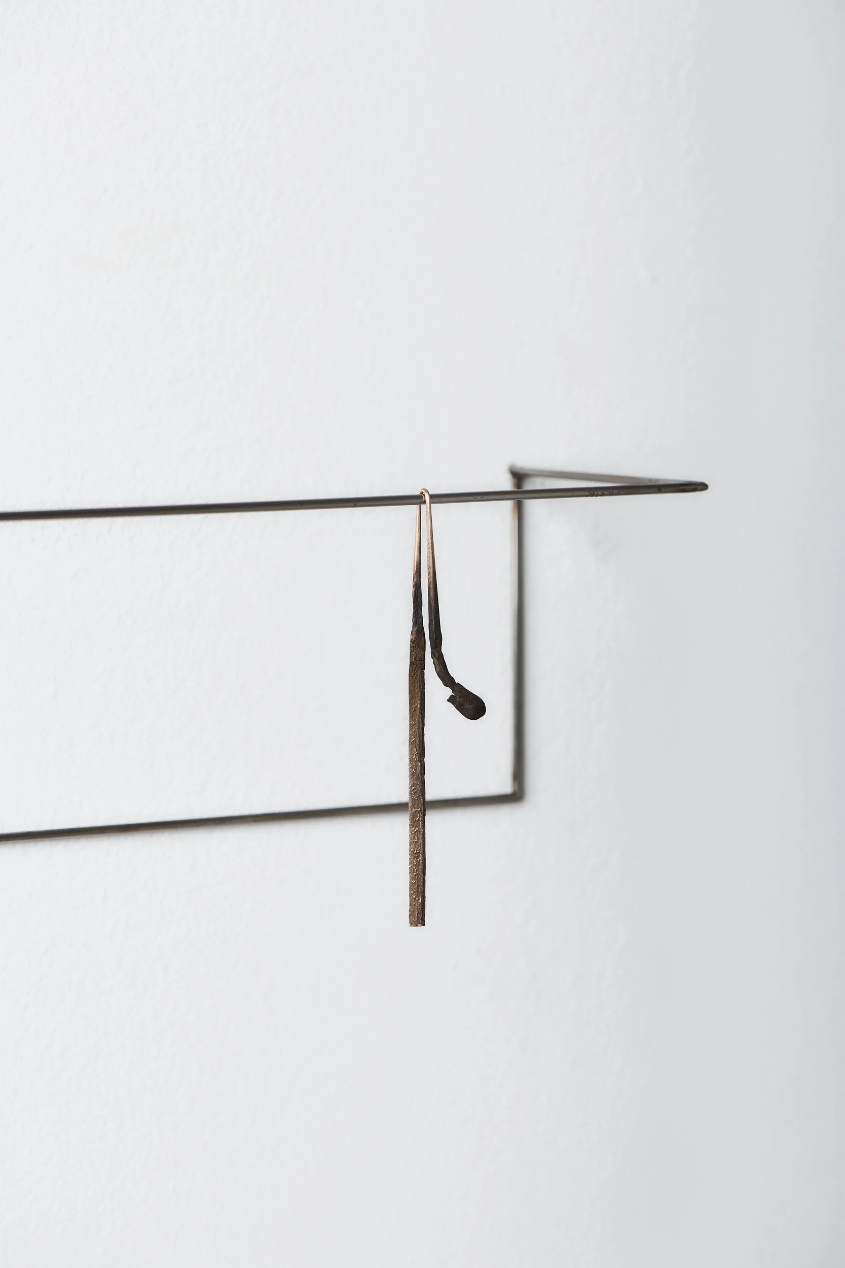   Slumped match , 2025 (detail) bronze, stainless steel 10 × 30 × 8 cm 
