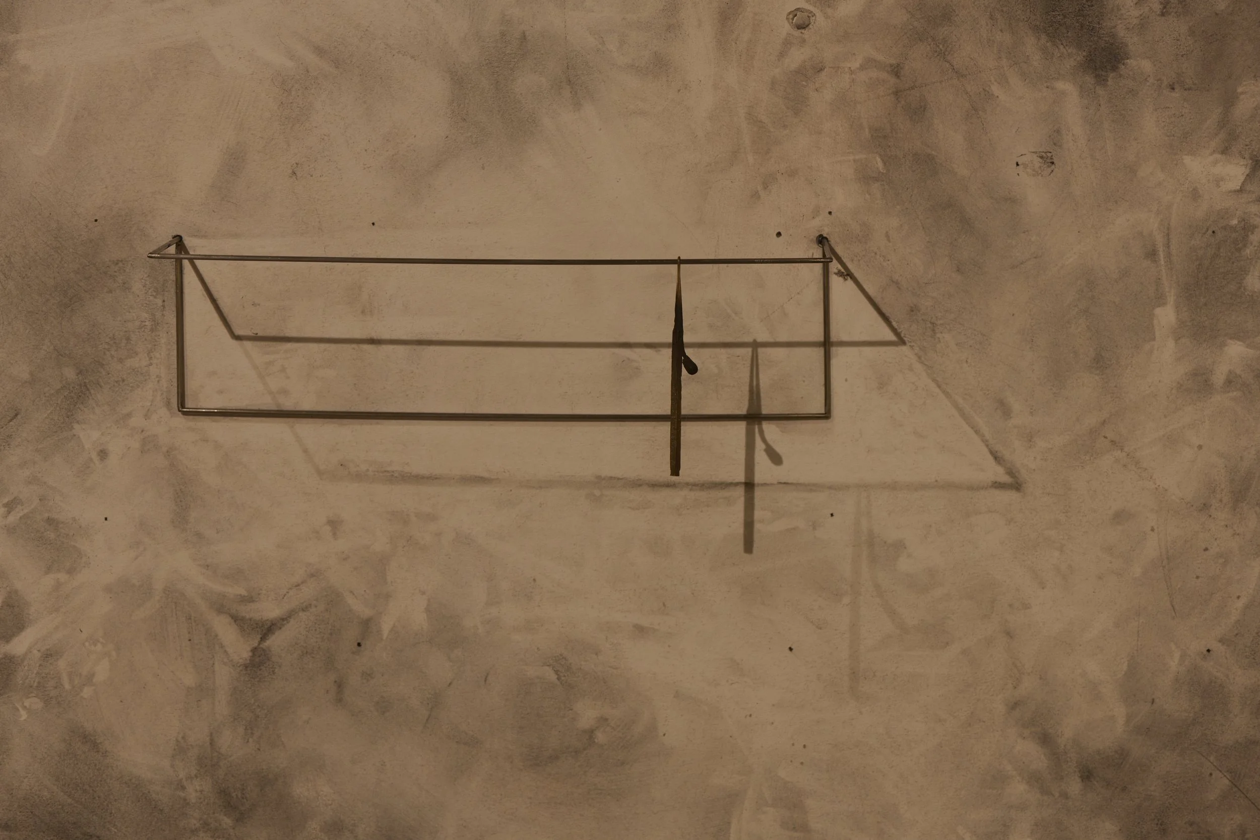   Slumped match , 2025 bronze, stainless steel 10 × 30 × 8 cm 