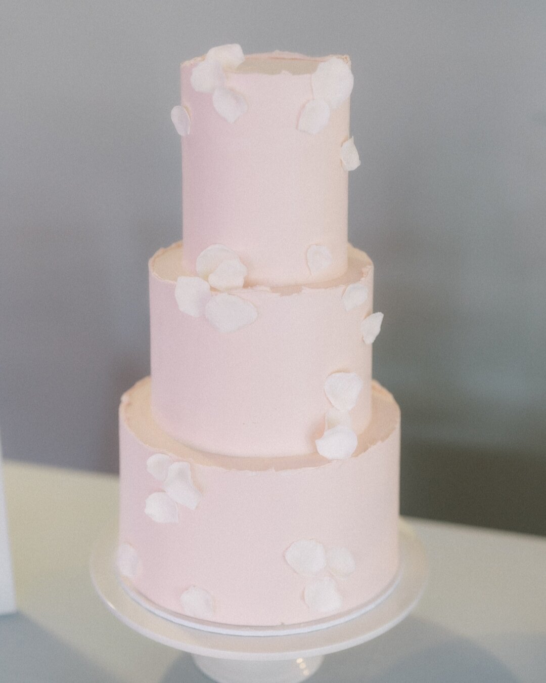 Pink Petals 💕//
Three tiers of sweetness, love, and joy! 🍰💕 
We are loving the colours some of this seasons cakes are bringing! And these handmade petals. 

The 2023/2024 wedding season has been an absolute delight, showcasing fun, yet elegant cre
