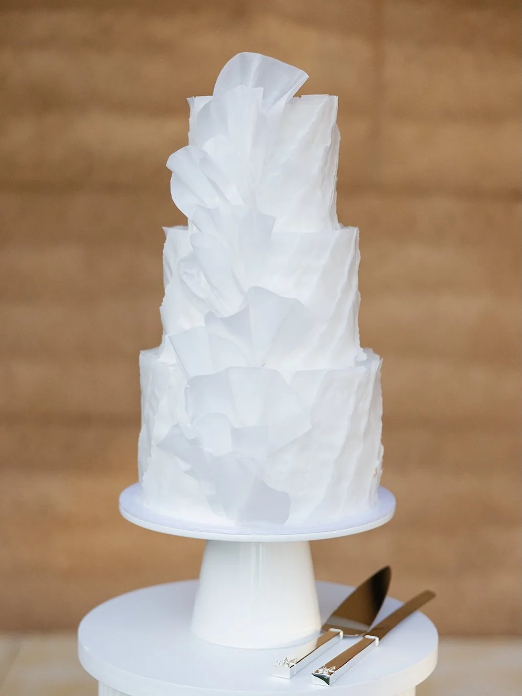 Charlotte &amp; Griffin 🤍✨
A three-tier design wrapped in delicate textures and finished with soft ruffles cascading down the front. 

Flavours included Passionfruit &amp; Elderflower and Vanilla Bean &amp; Raspberry. The perfect pairing for a beaut