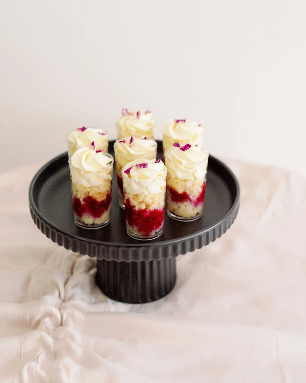 Raspberry Cake Cups 🍓✨
Made with home-made berry compote packed with real raspberries, our vanilla-bean cake base and Italian meringue buttercream! 🍓

Cake Cups - @sieveandstone
Photography - @_westerly
