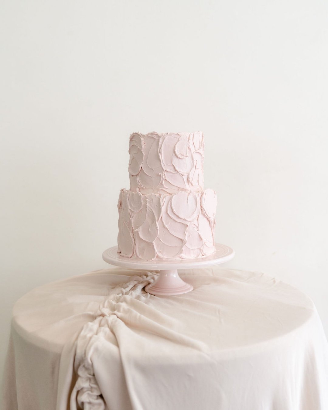 The Charlotte 🎀
Over-iced, over-the-top and perfectly imperfect, in the best possible way. ♡

Finished in the softest blush pink ganache, with layers of buttercream inside. A little playful, a little romantic, and designed to make a statement.

Avai