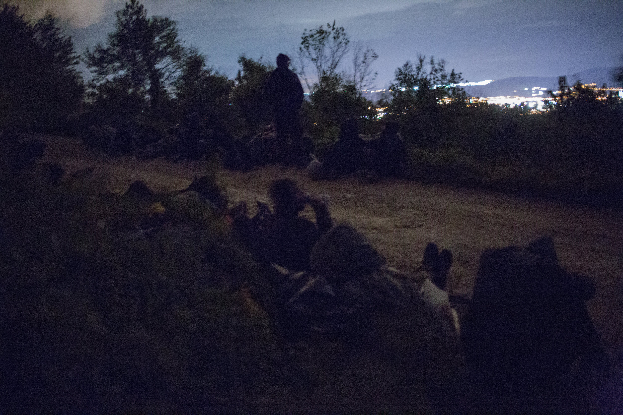 A group of refugees on a night walk near Zavalje in BiH towards Croatian border. For the most part, to avoid encountering police officers and residents, they choose less popular roads and places. The night shelters them from unwanted views. 