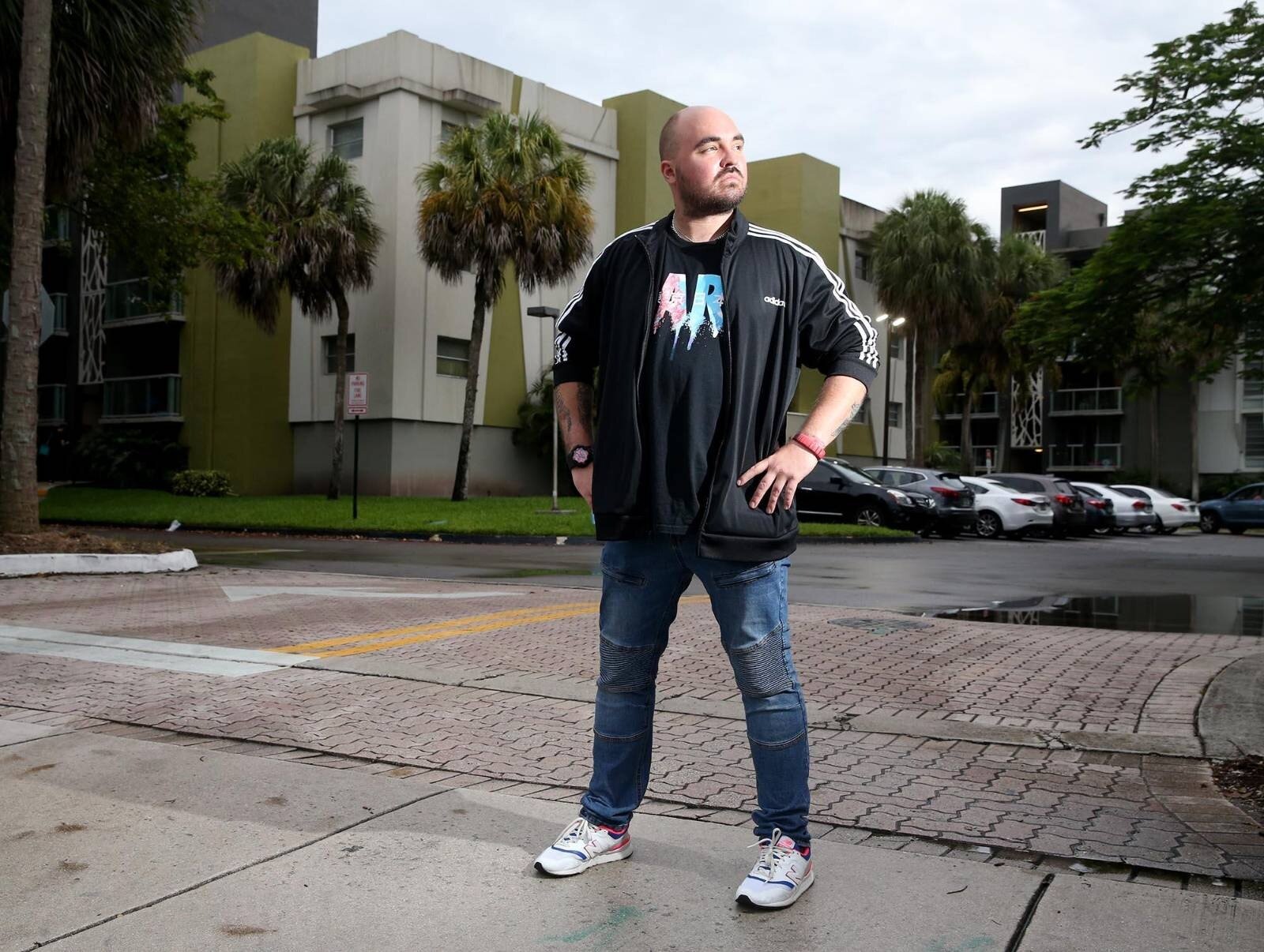  Carlos Lomena outside the Florida apartment building from which he was evicted. Photo: Charles Trainor Jr./Miami Herald/ICIJ 