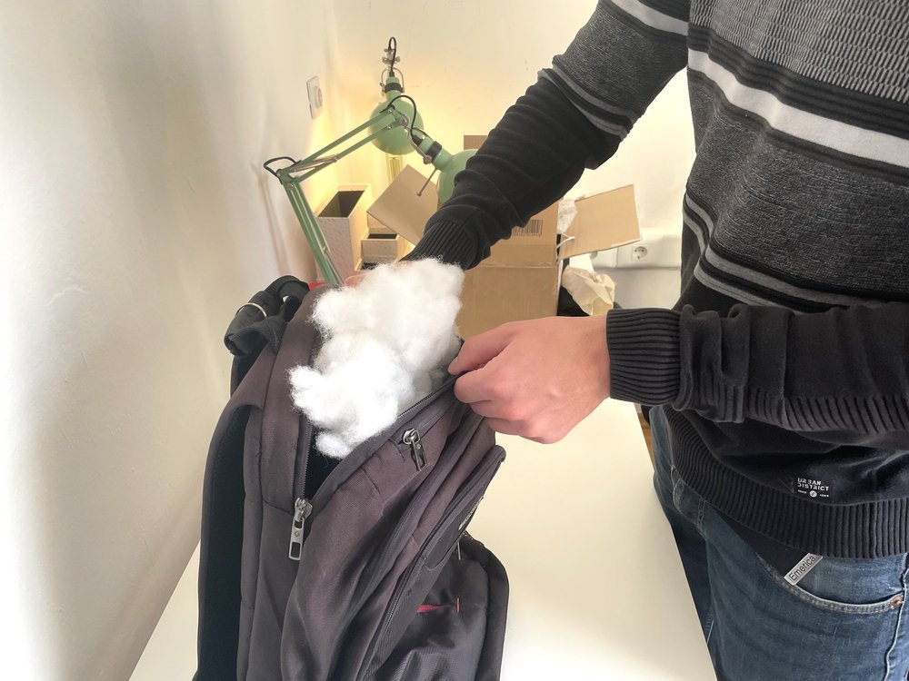  We filled a broken backpack’s pocket with foam in which we inserted the tracking device. 