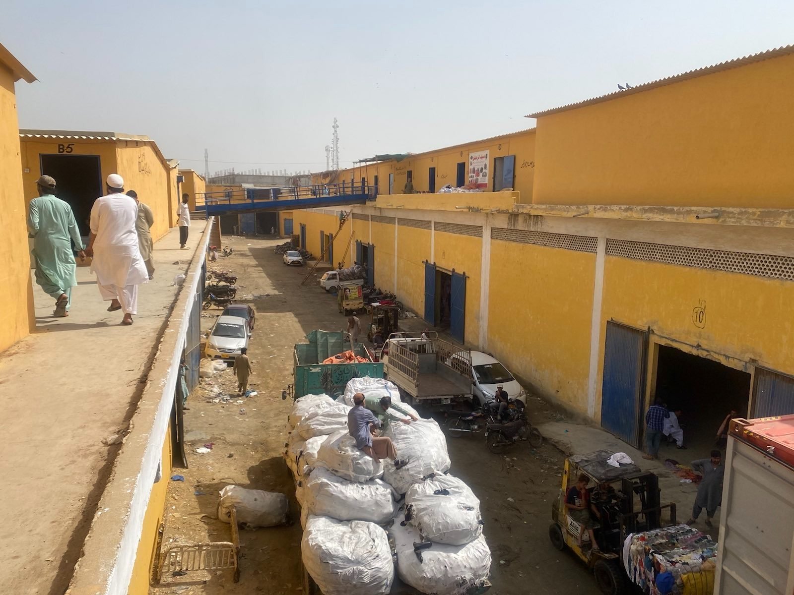  The wholesalers buy large bales that arrive on container ships and then sort them into smaller packages as per customers’ wishes. Photo: Adil Jawad 