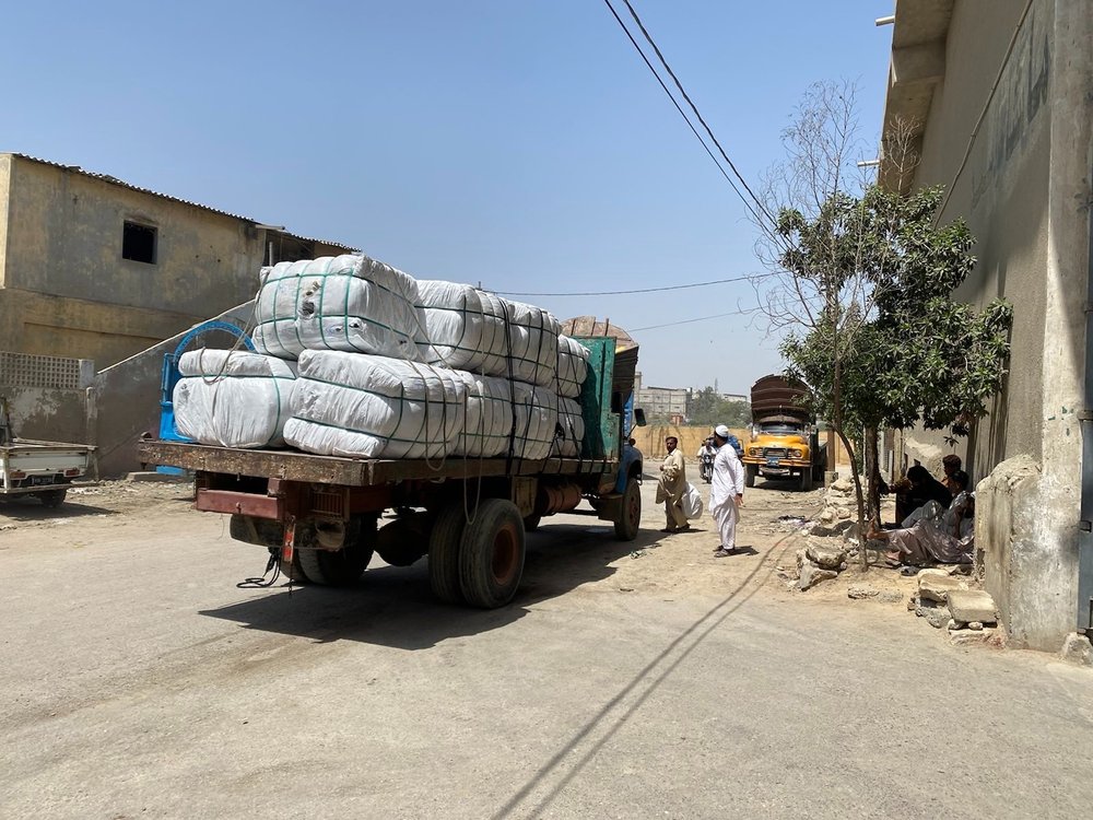  A lorry loaded with bales of second-hand clothing in Karachi that arrived in Pakistan from the west. Photo: Adil Jawad 