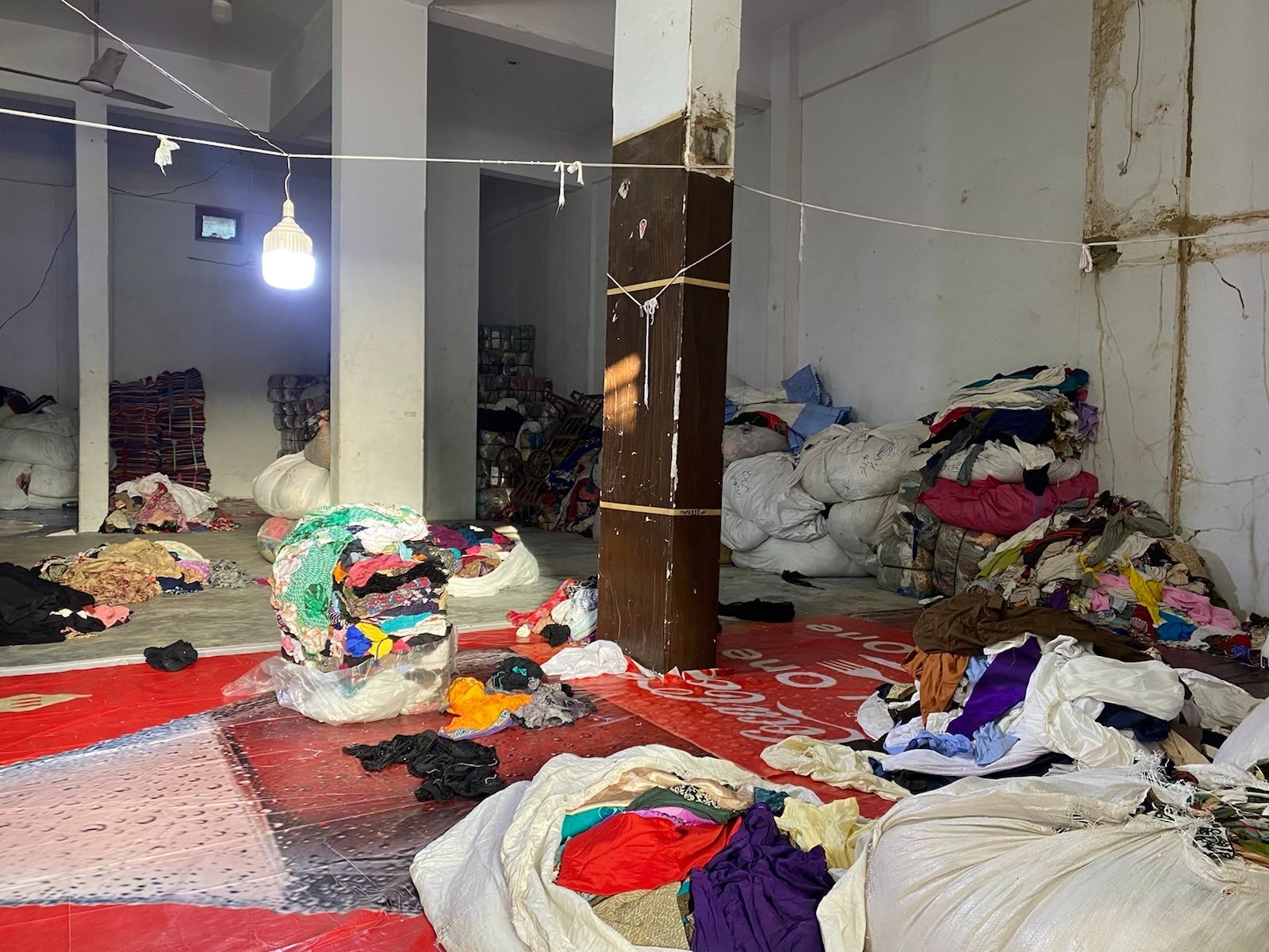  One of the warehouses where second-hand clothing is stored. Photo: Adil Jawad 