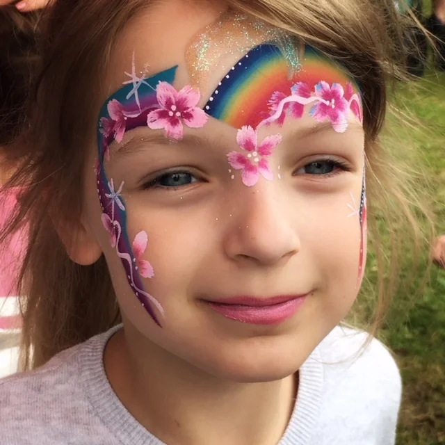 Rainbow flower face paint.jpeg