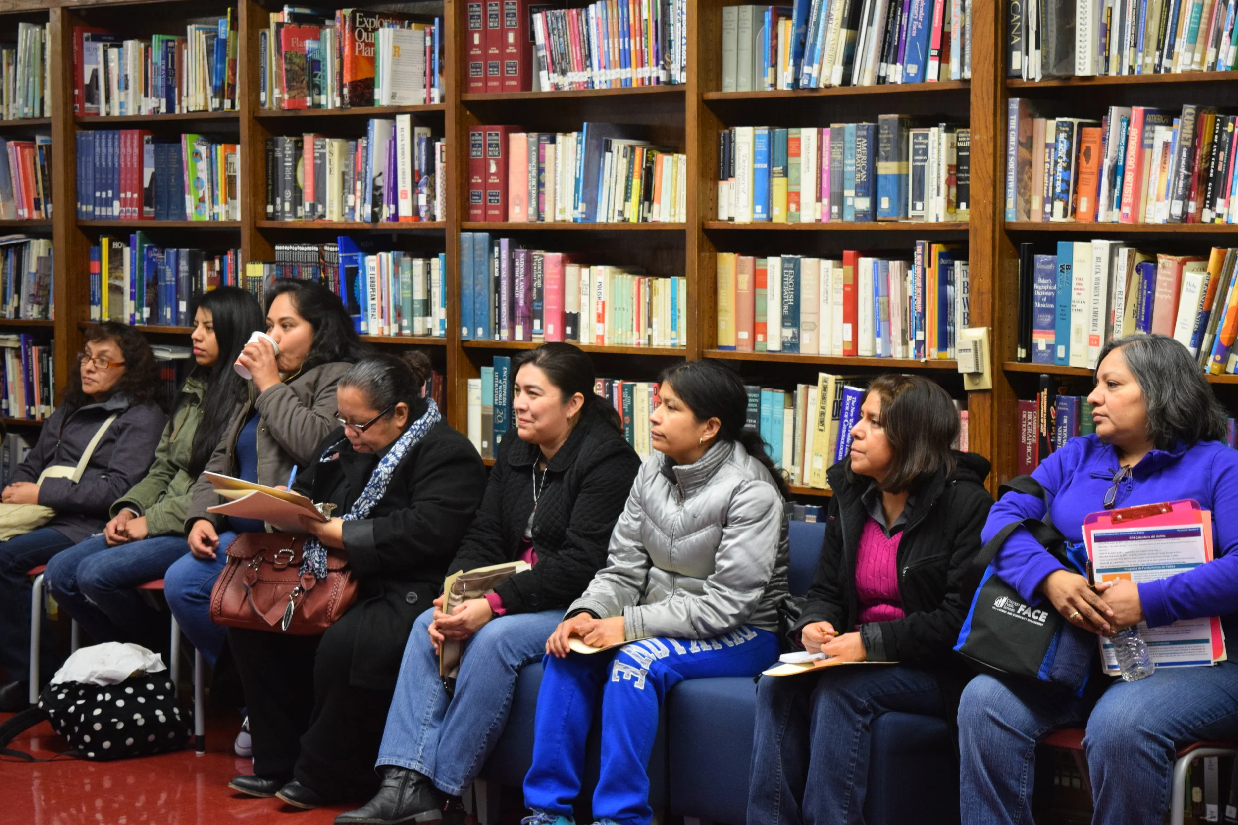 2017 PARENT FOCUS GROUP. Parents gather in a school library to share their experiences with the Chicago school enrollment process.