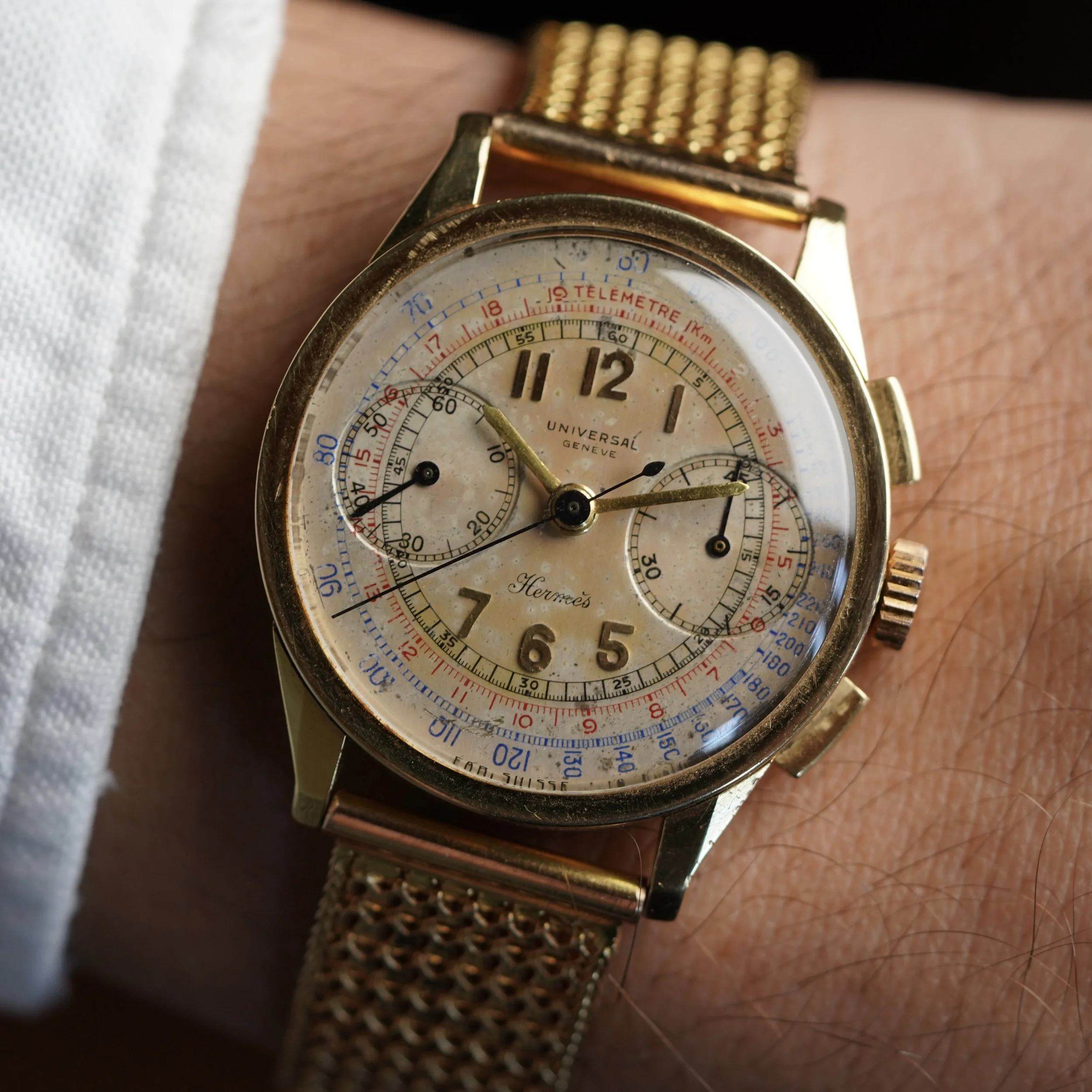 Universal Genève Hermès Compax Chronograph in 18k Yellow Gold on Bracelet w/ Extract, Box and French Magazine