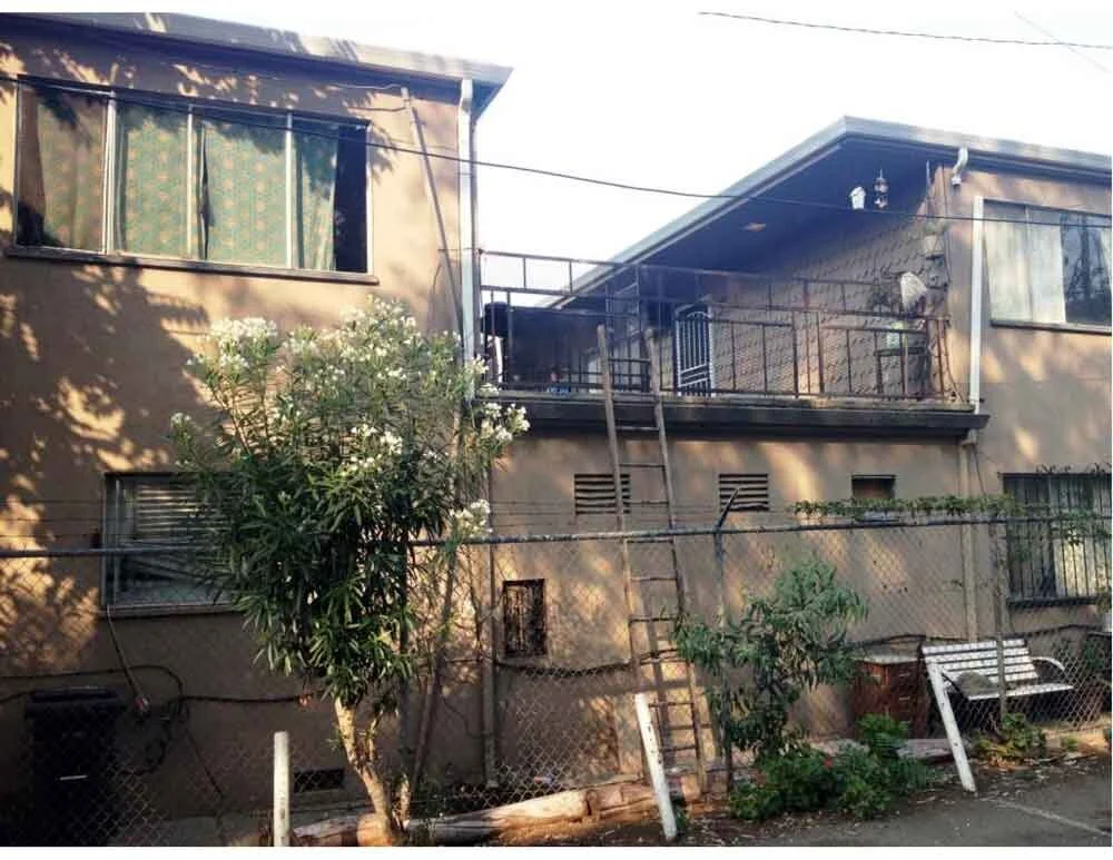 From Neighborhood Cancer to Community Asset: Turning an Apartment Building Around