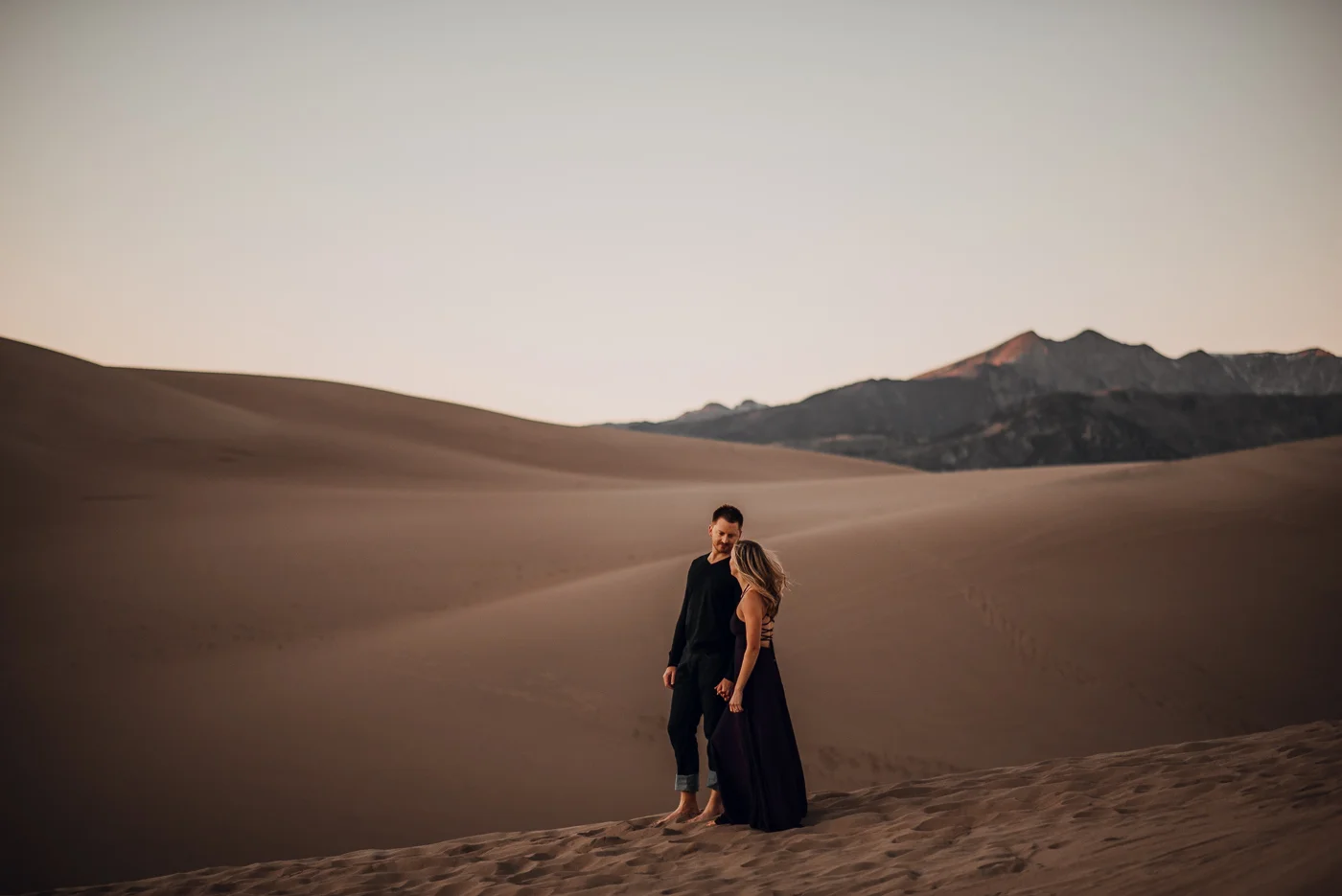 Great Sand Dunes Engagement Session PHOCO Photographer Colorado Flowy Dress Dark Moody-10.jpg