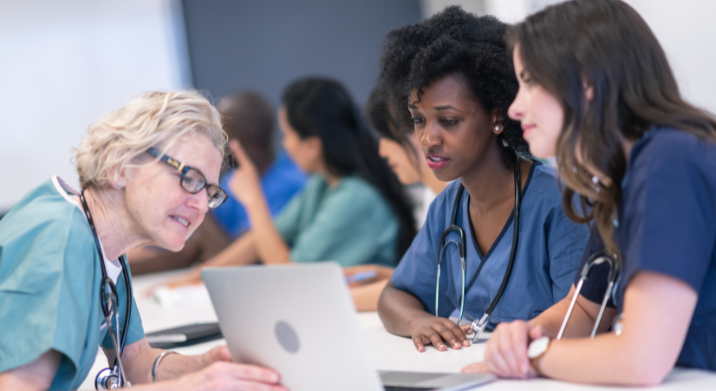 certified nurse assistants working together with a nurse