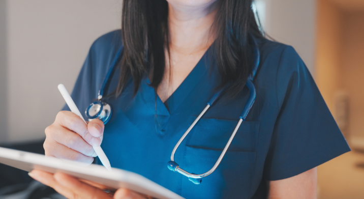 certified nurse assistant taking notes