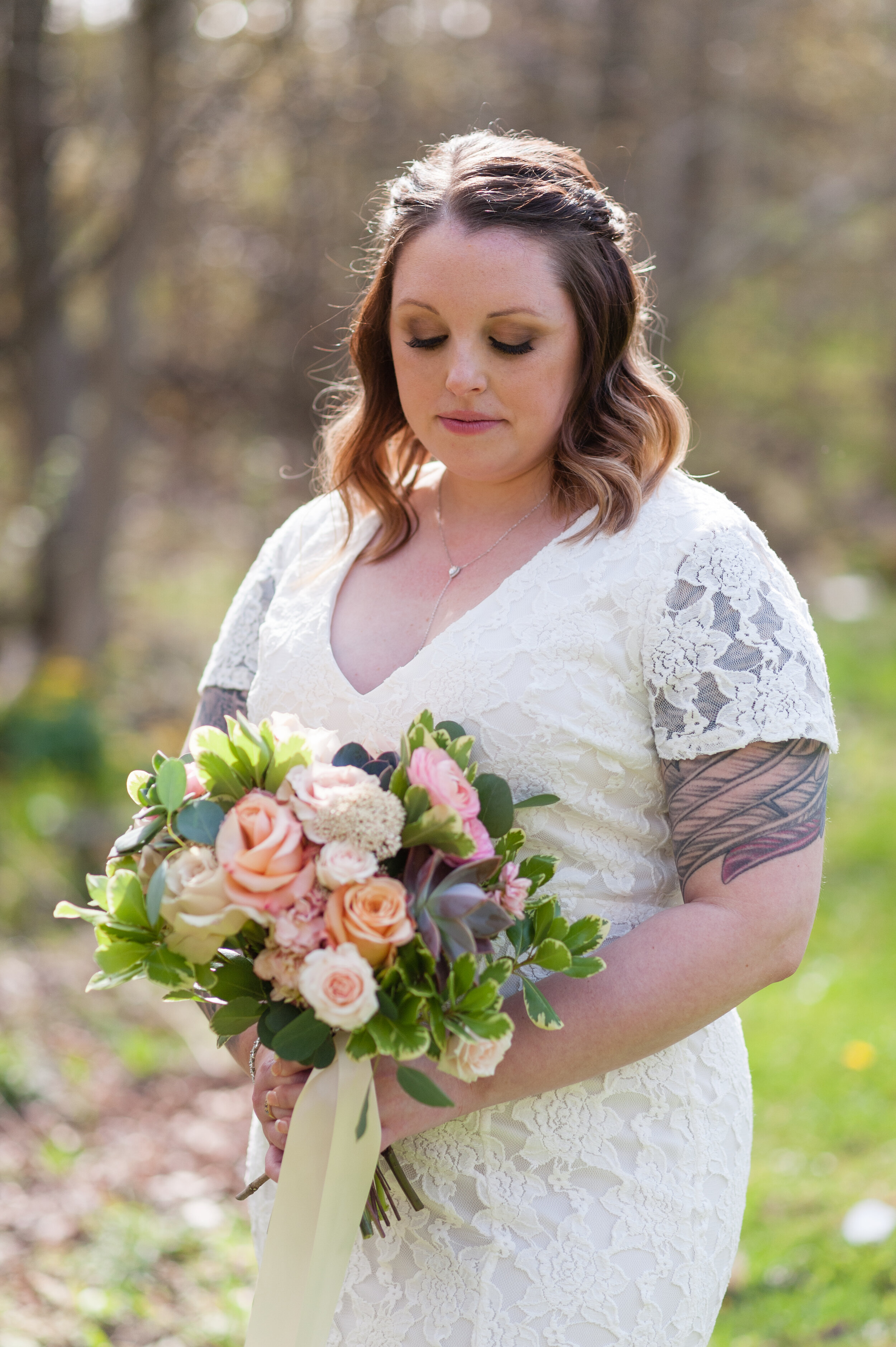 Green Bay backyard wedding bride with succulent bouquet
