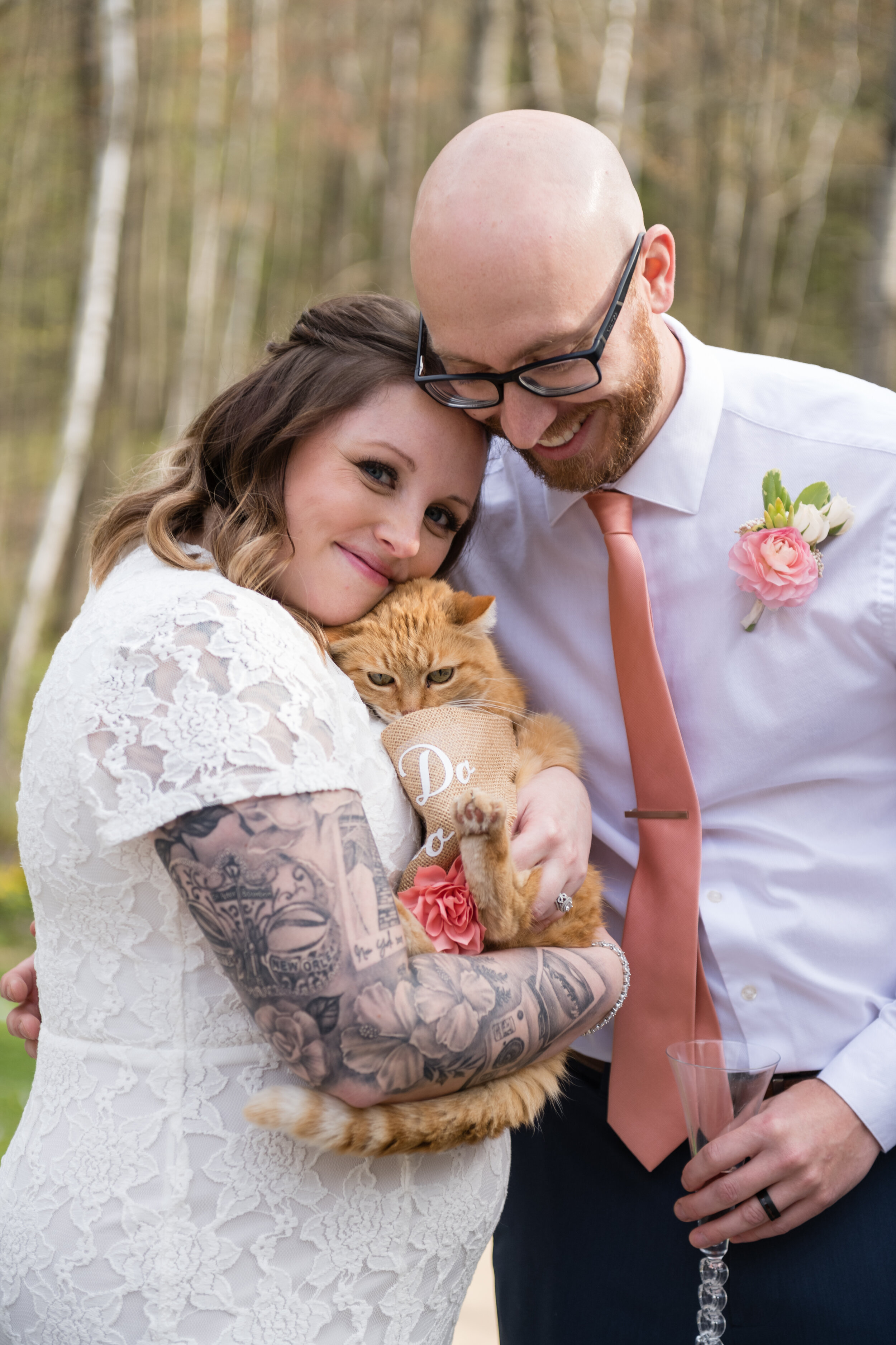 Green Bay backyard wedding bride and groom with cat pets on wedding day
