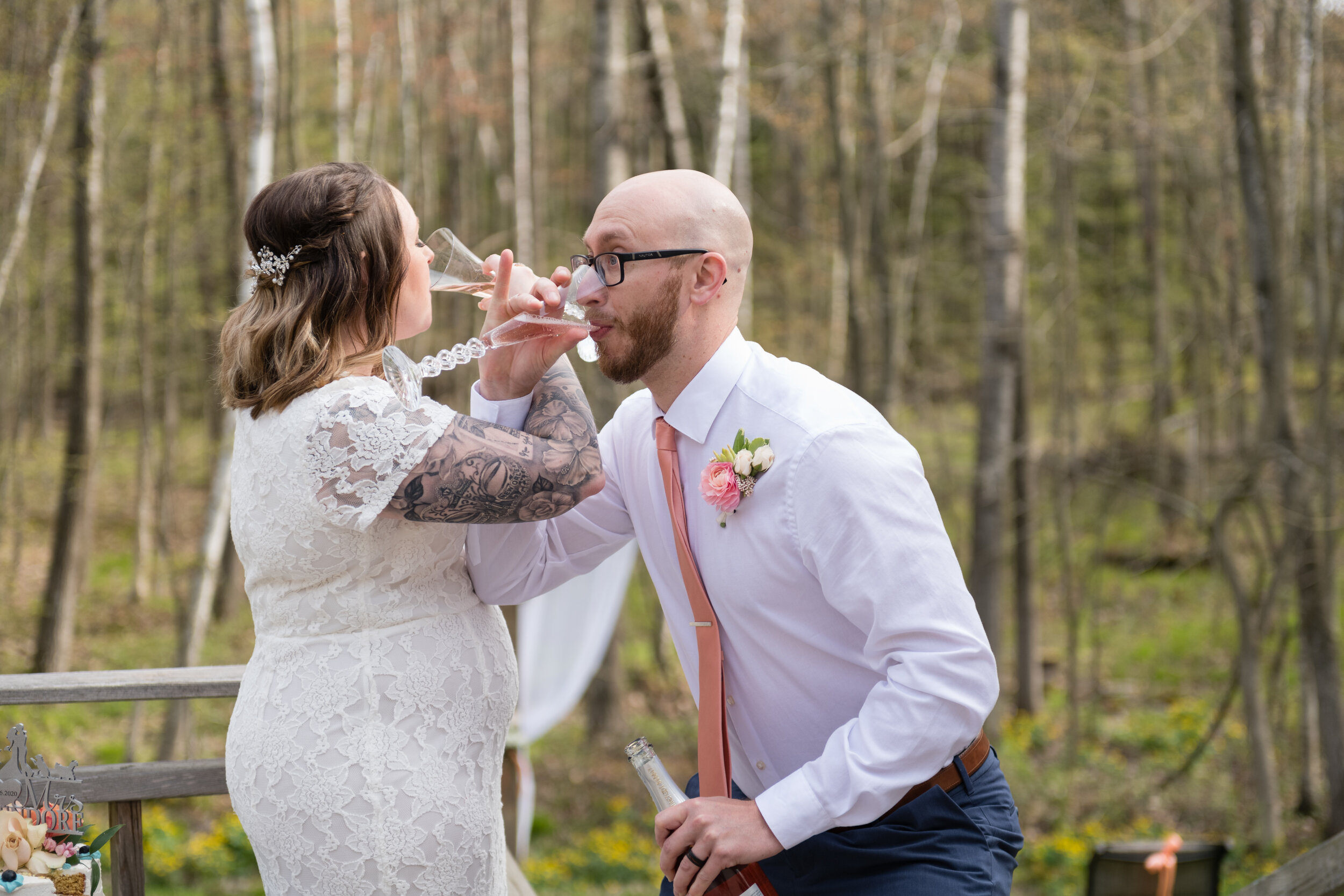 Green Bay backyard woods wedding bride and groom drinking