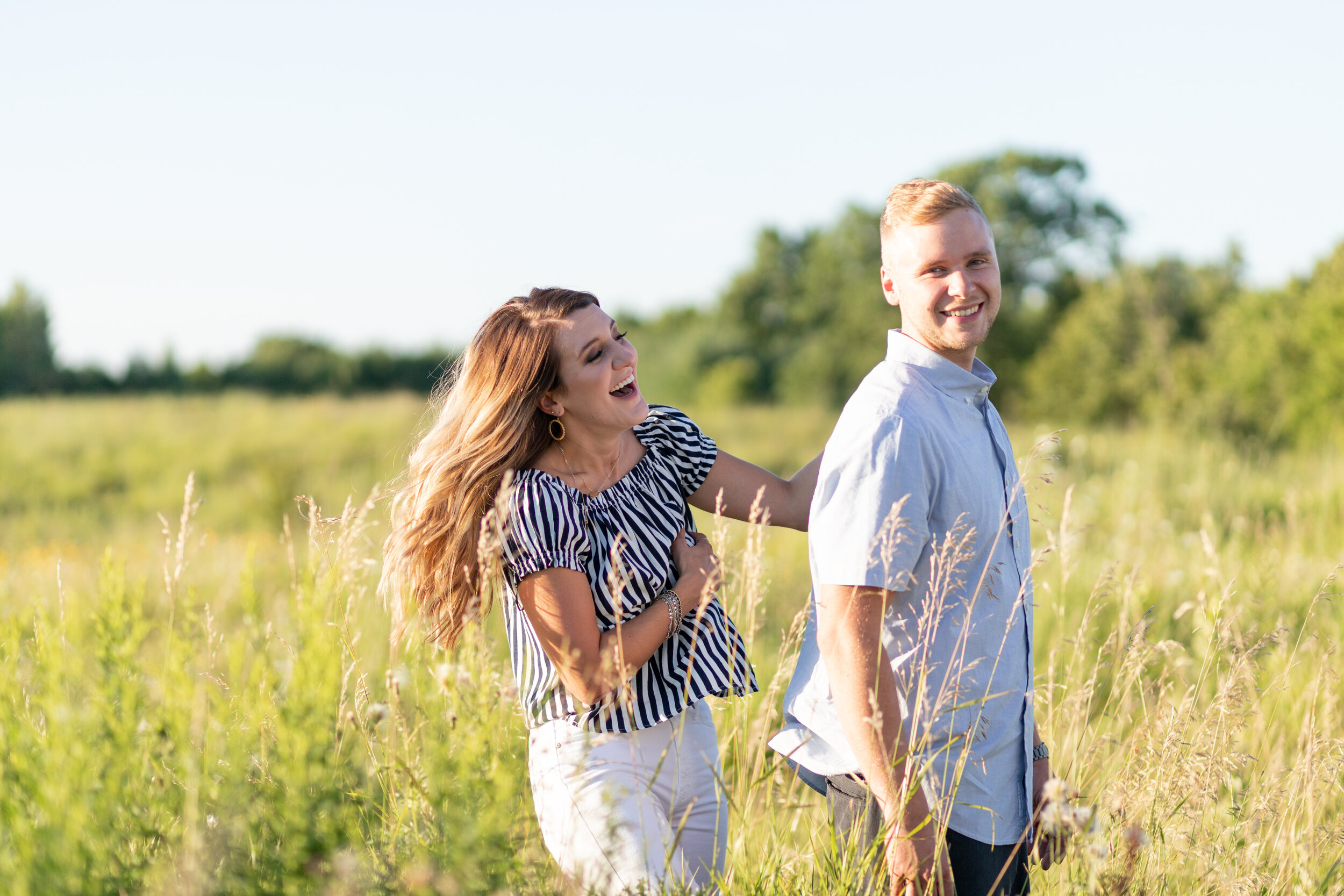 engaged couple laughing at Fonferek Glen Green Bay Wisconsin