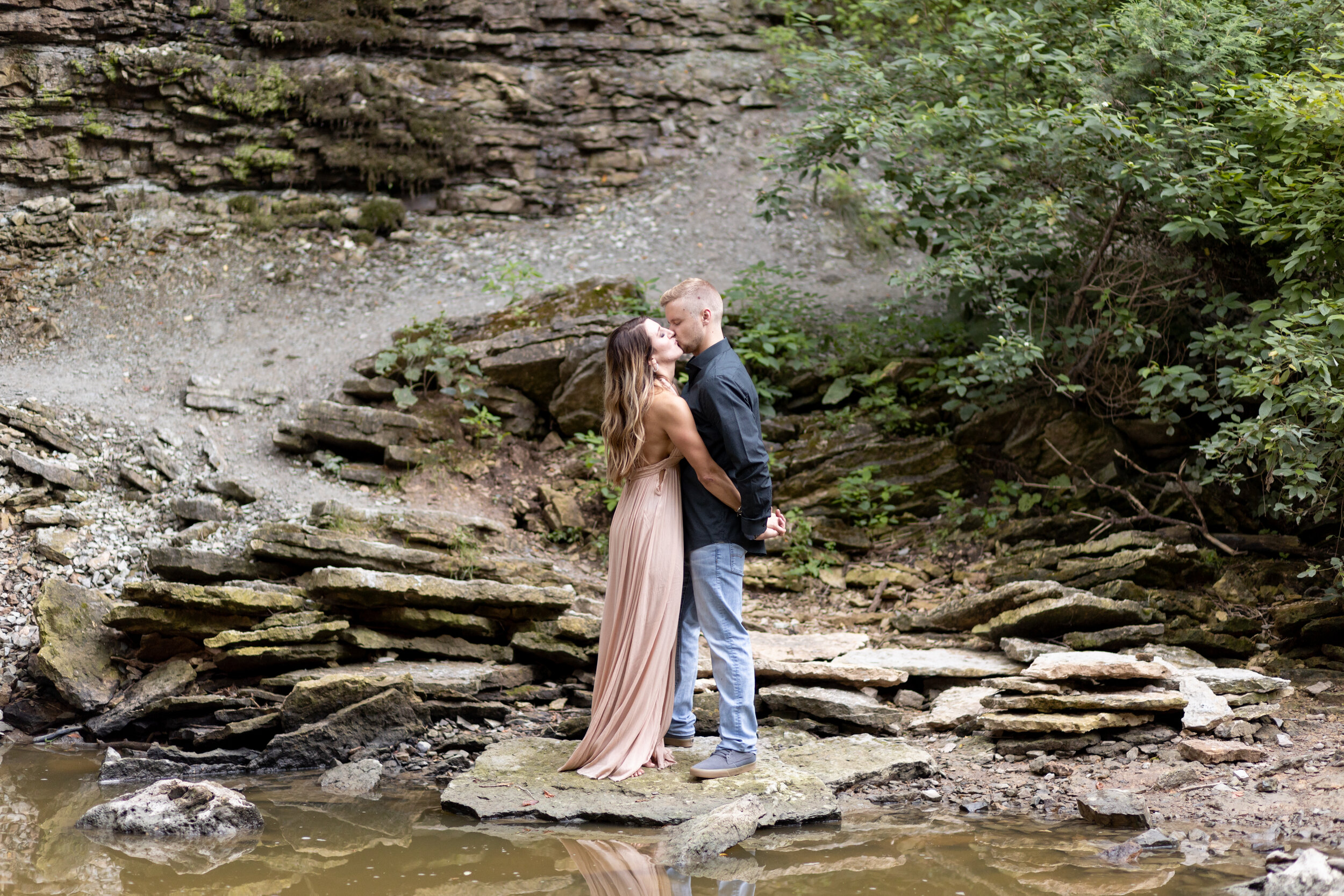 engaged couple kissing at Wequiock Falls Green Bay Wisconsin