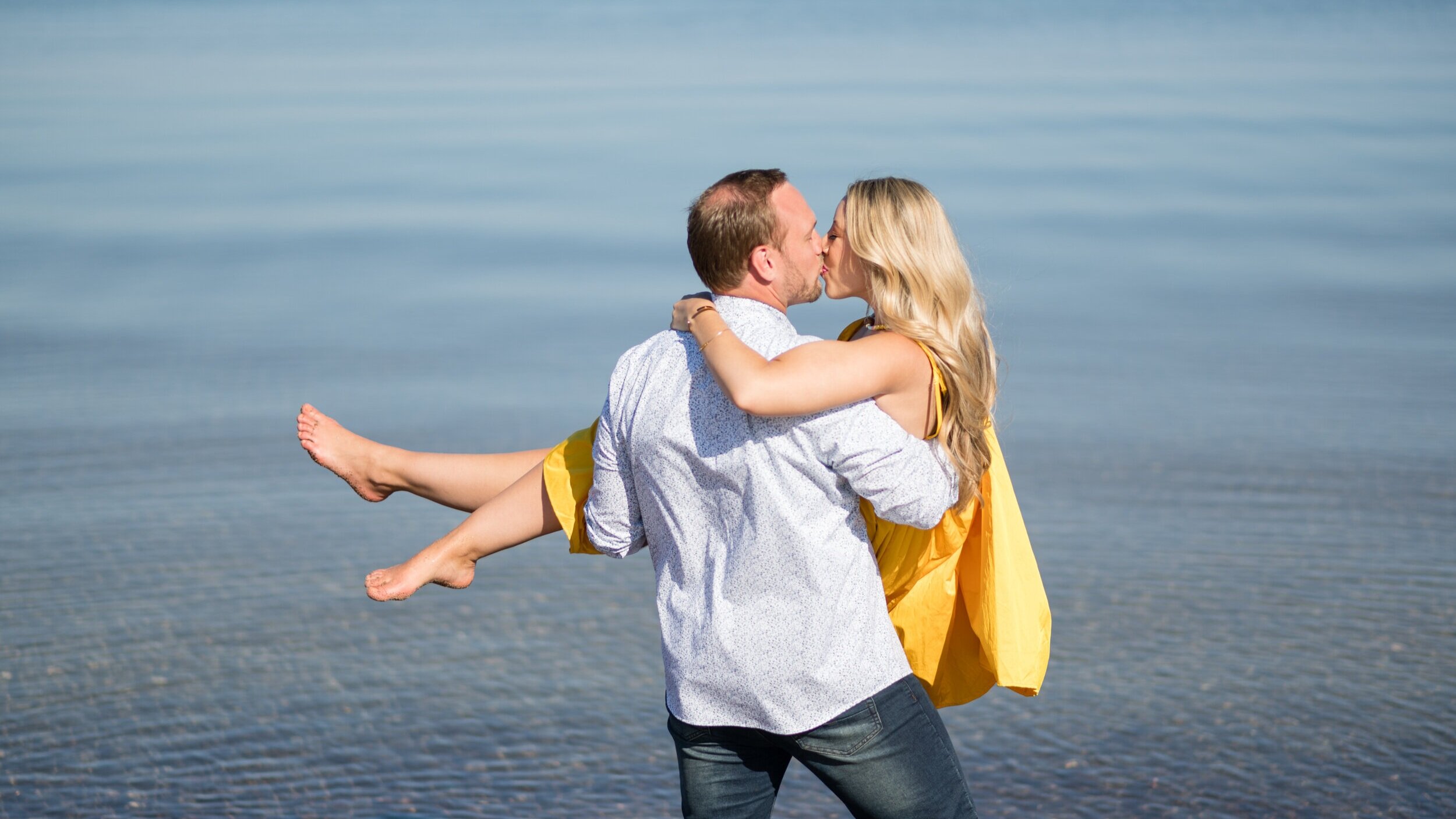 Romantic beach and waterfall summer engagement session in the upper peninsula