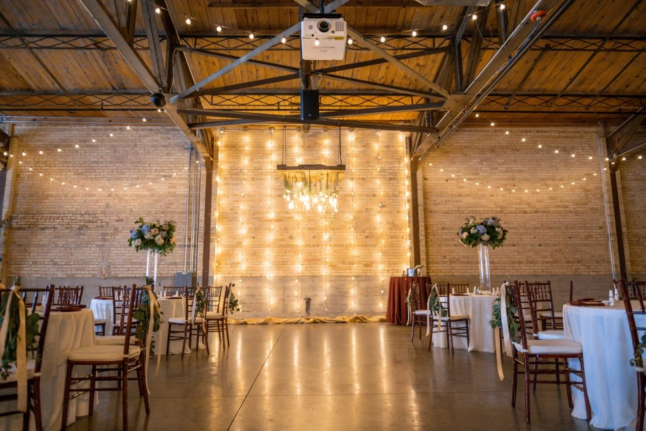 Stunning luxury wedding at Gather on Broadway with industrial chic vibe and string lights