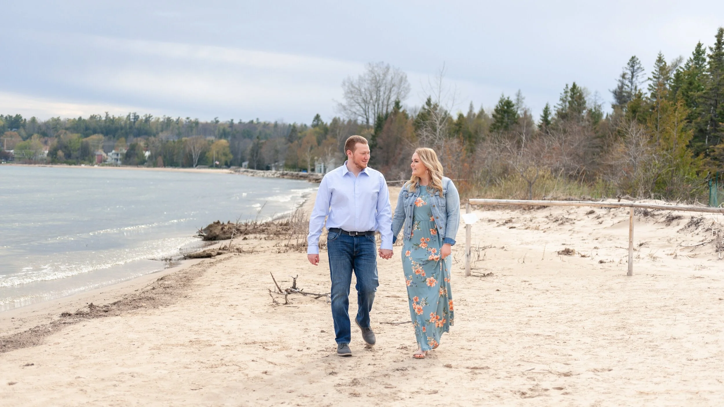 cute couple walking on the beach in Door County, Wisconsin