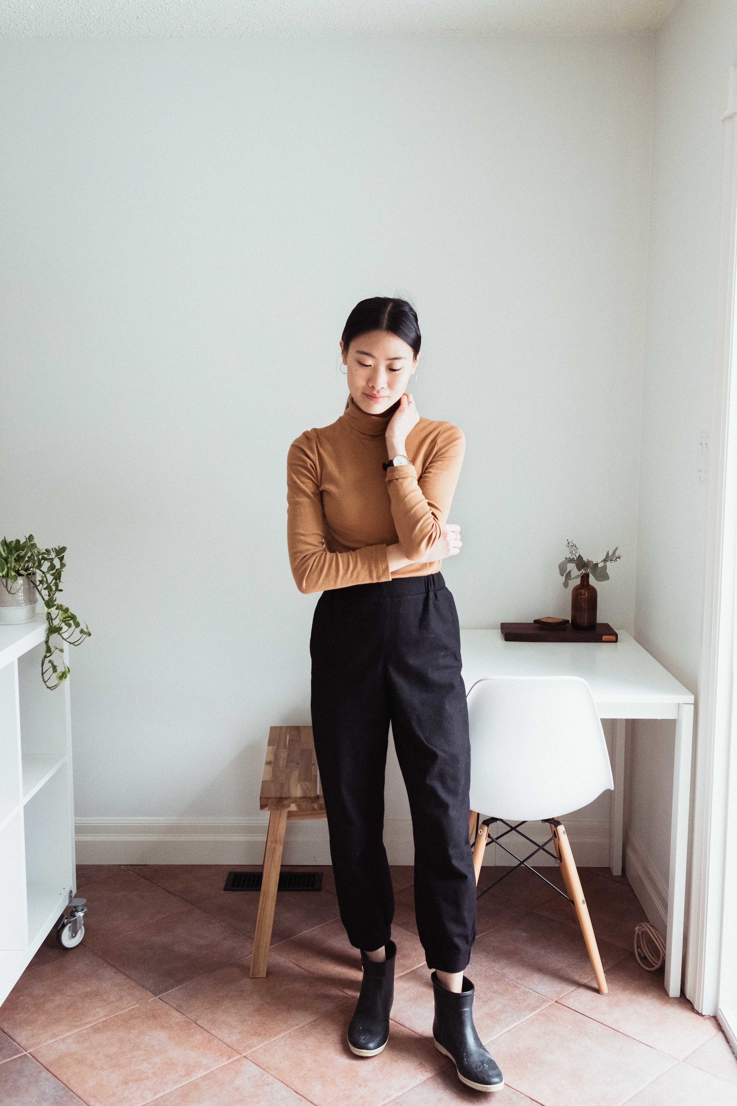 An outfit featuring an organic cotton turtleneck by Kotn and wool trousers by COS. See more on wool below!