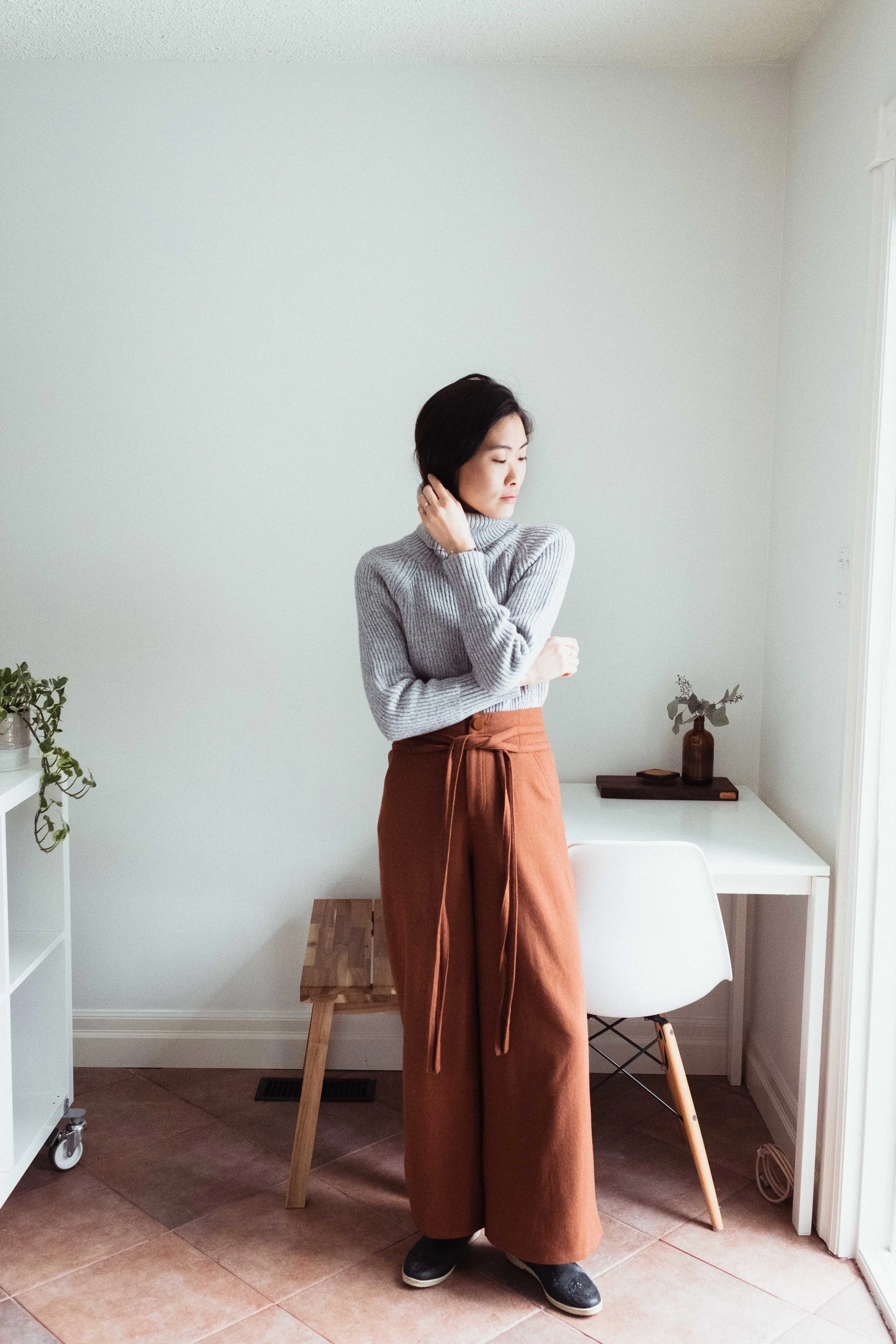 I’m wearing an old Aritzia 100% wool knit here paired with some wide-leg wool trousers by SKYE .