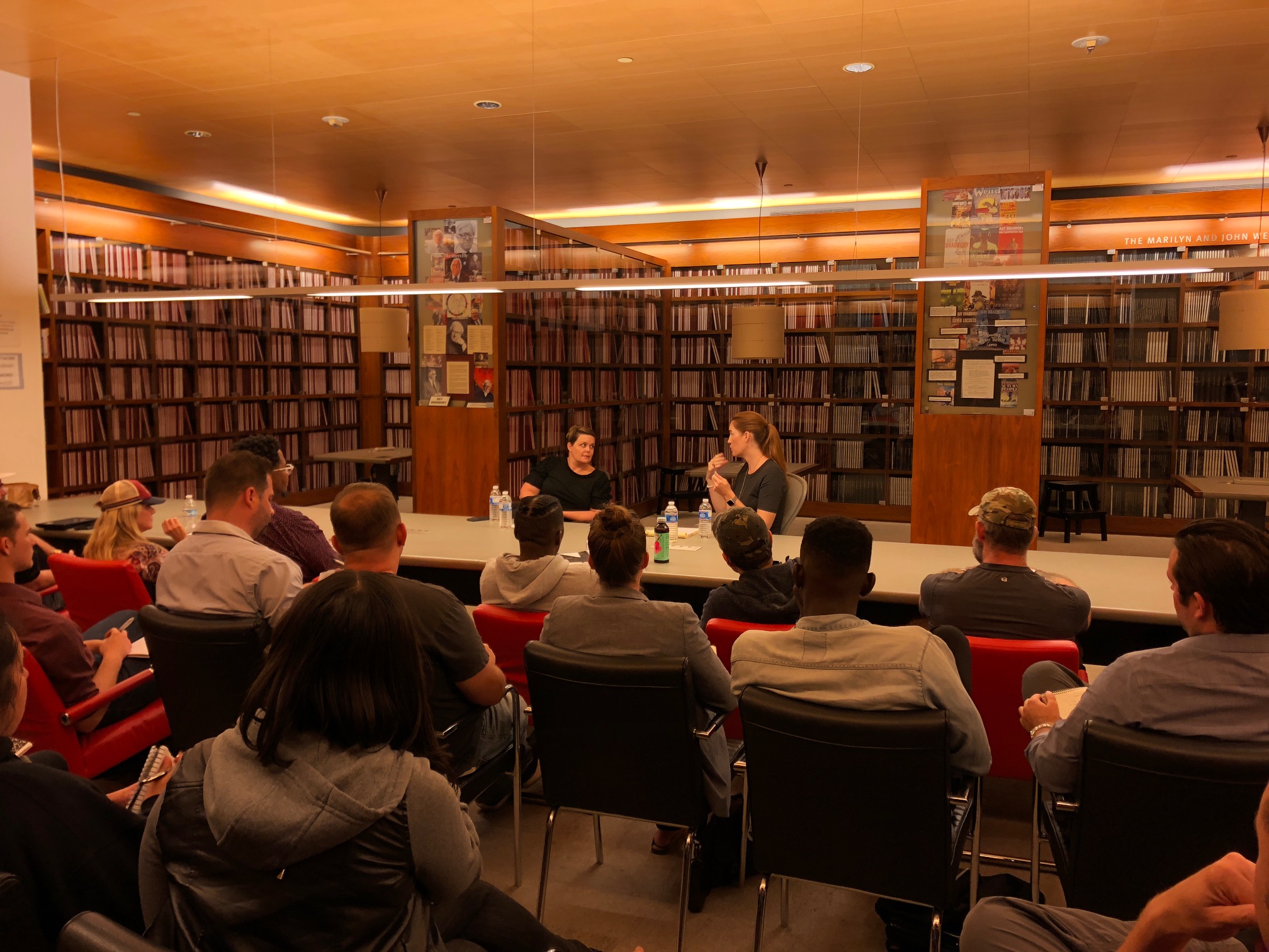 Amy Gravitt, HBO VP of Development, and mentor Marlana Hope in discussion with participants in the Veterans Writing Project in August 2018.