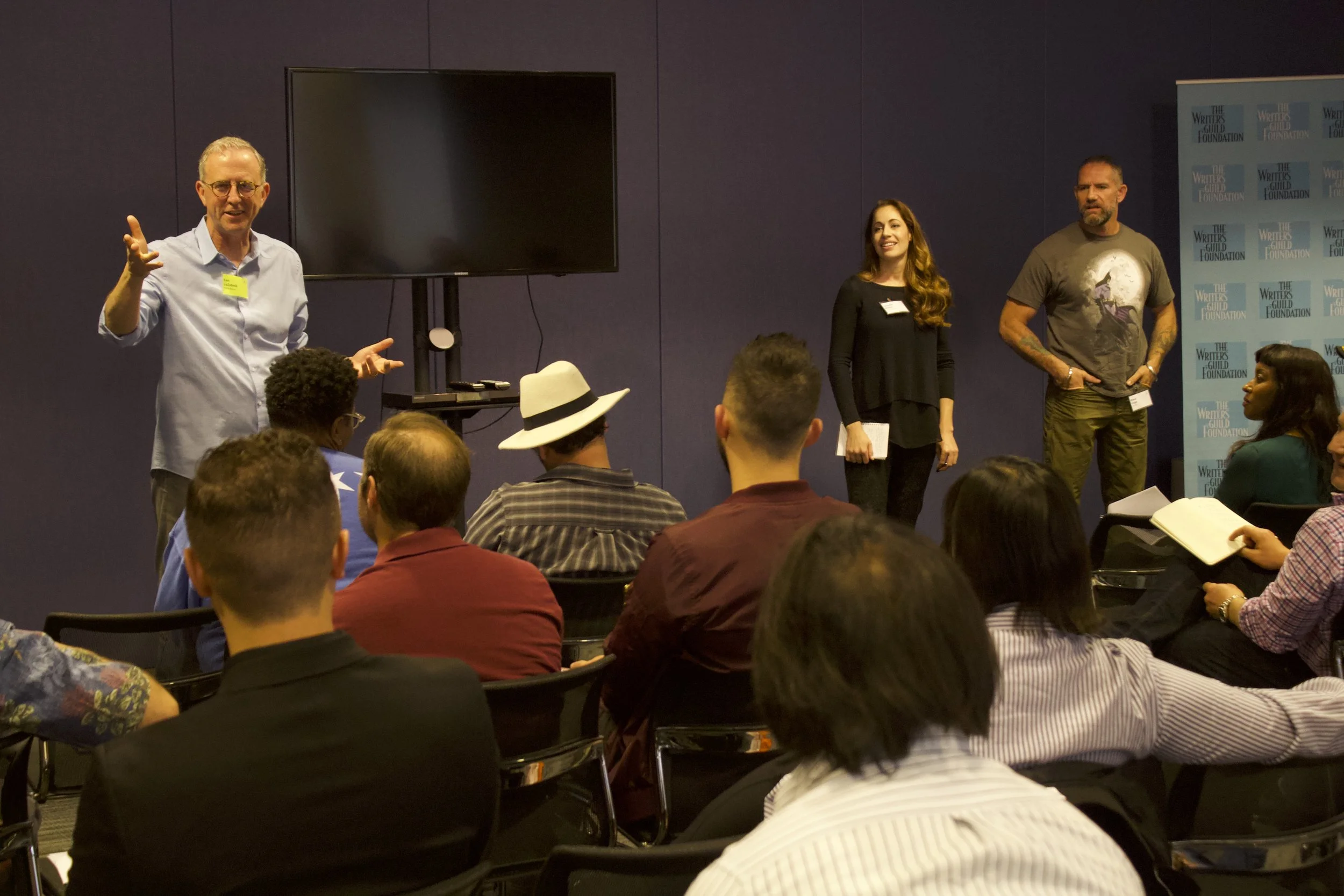Group shot of the 2018 program participants listening to a lecture