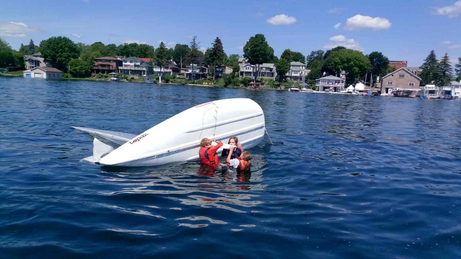 Brockville Yacht Club Sailing School righting capsized boat.jpg