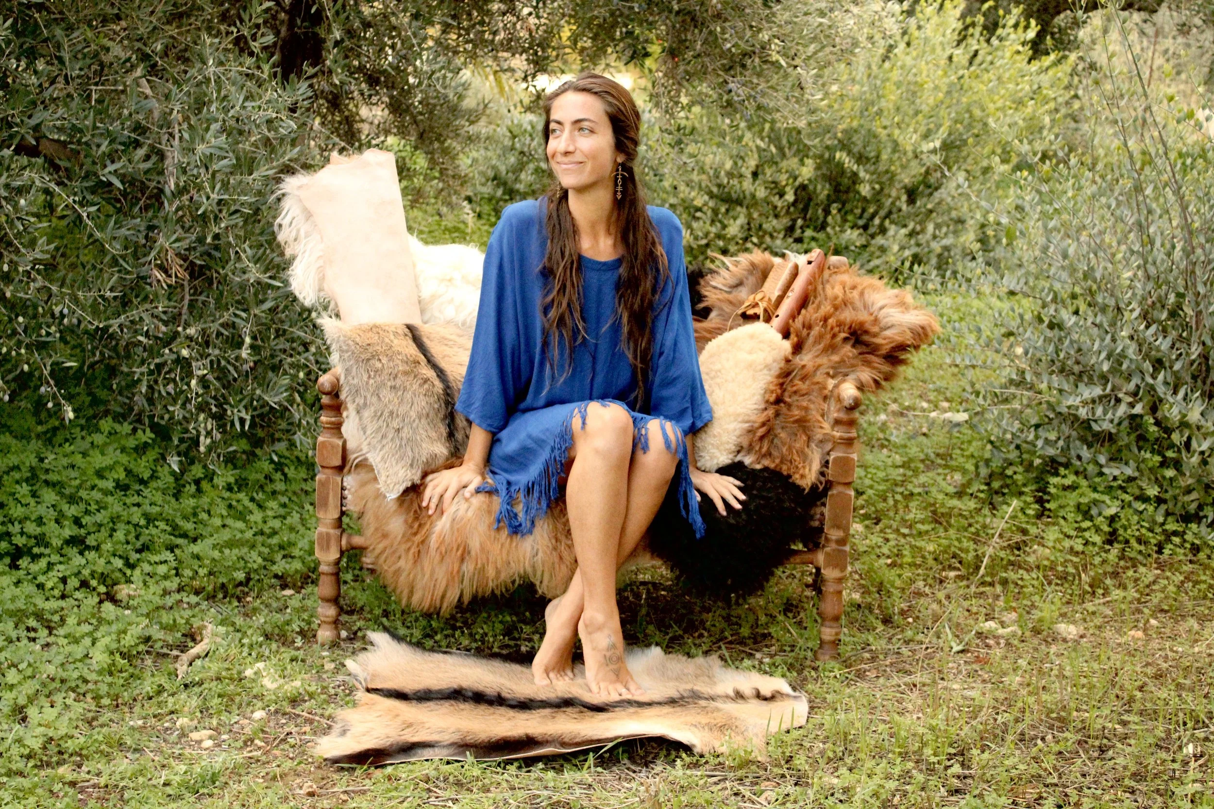 paulina in the olive grove with sheepskins from crete