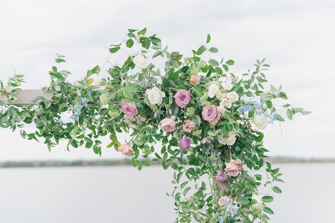 Enchanted blooms in a beautiful setting!🌸✨
Soft blush roses paired with pops of pastel pinks and blues create the perfect balance of elegance and color. 

Photography: @kdimeg_photo
Venue: @the_island_house
Hair and Makeup: @canaryrocksalon
Cake: @t