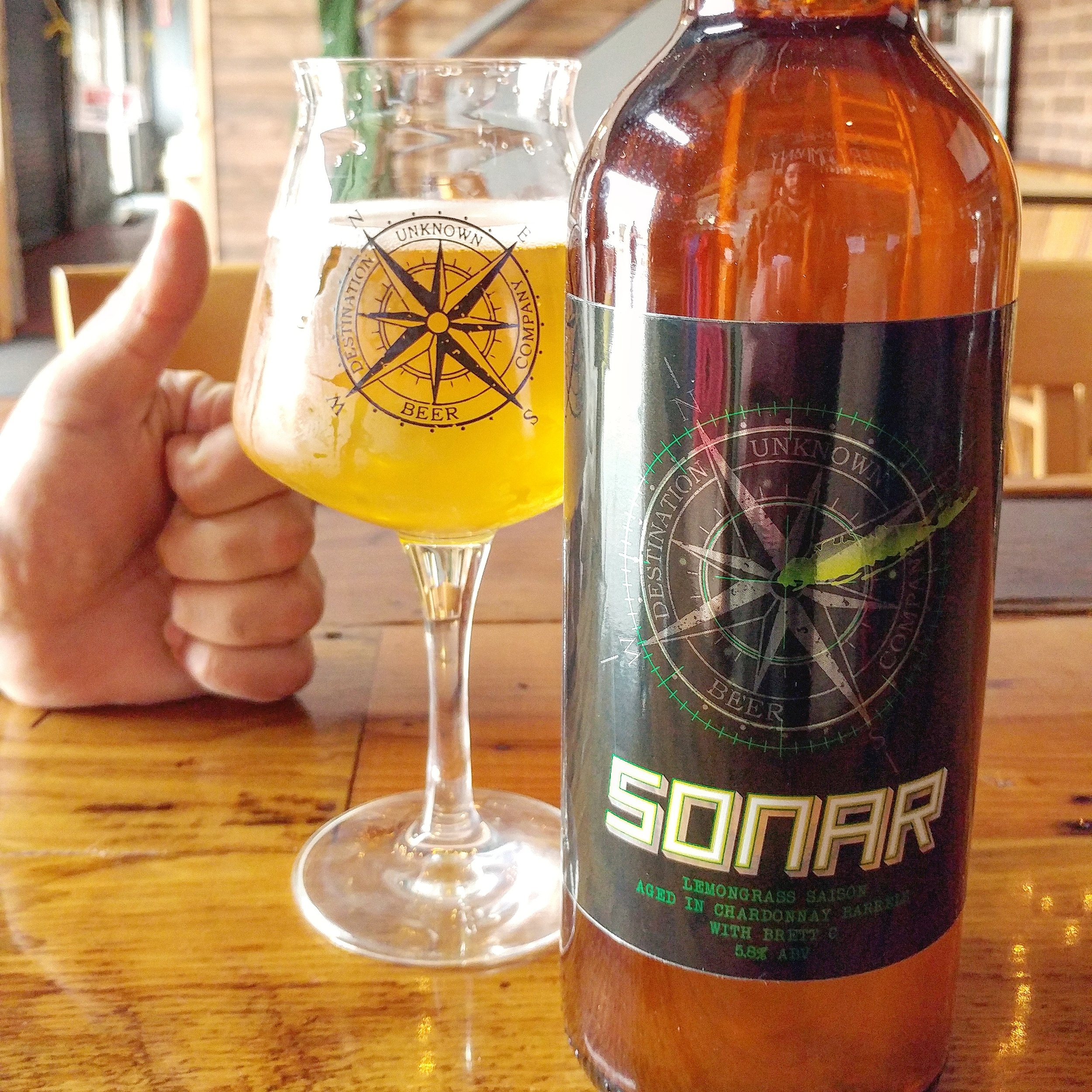  Here’s the bottle, the delicious beer in a DUBCO teku, and John’s thumb’s up approval. 