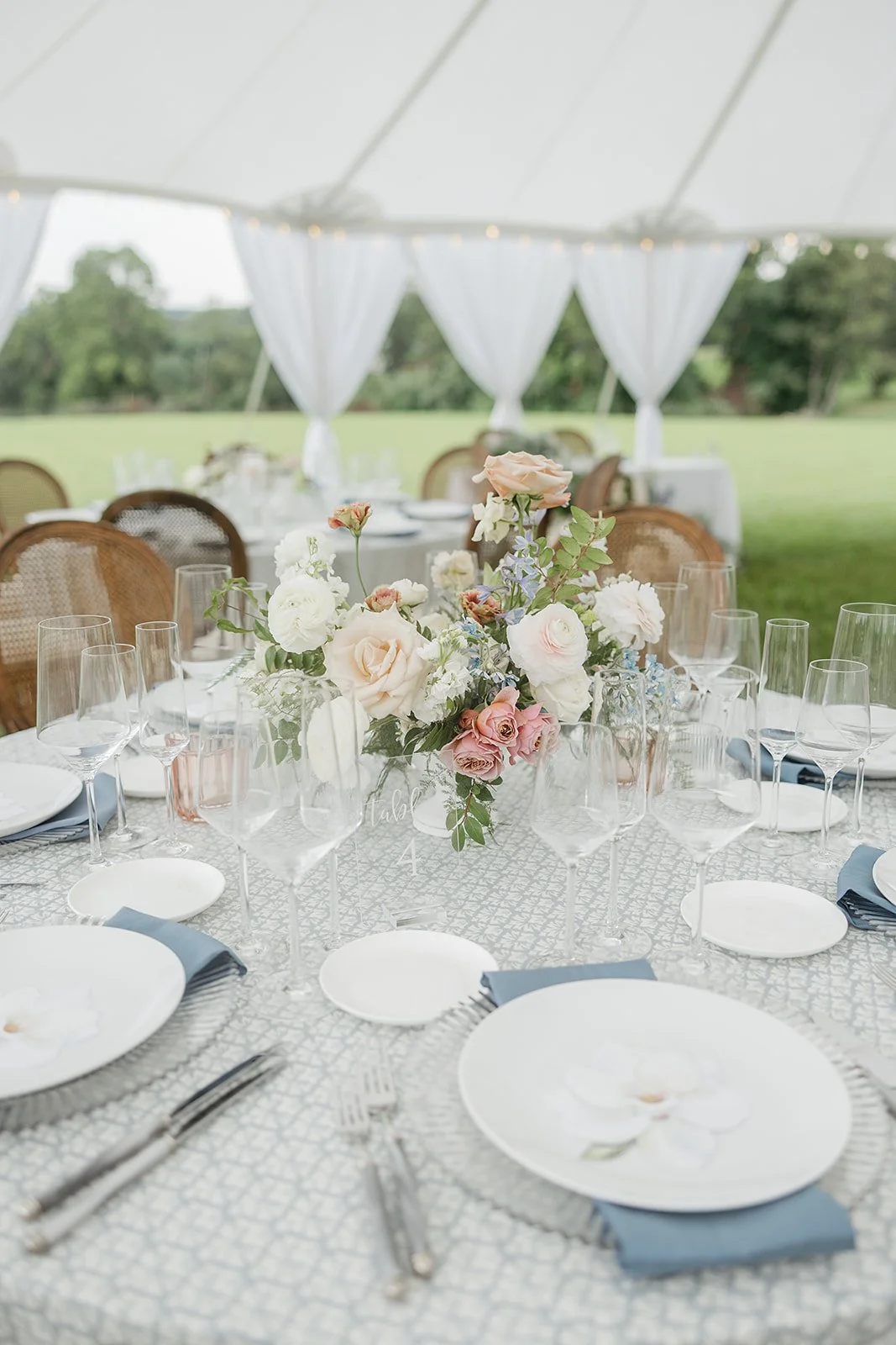 Centerpiece table setting tent drapes.jpeg