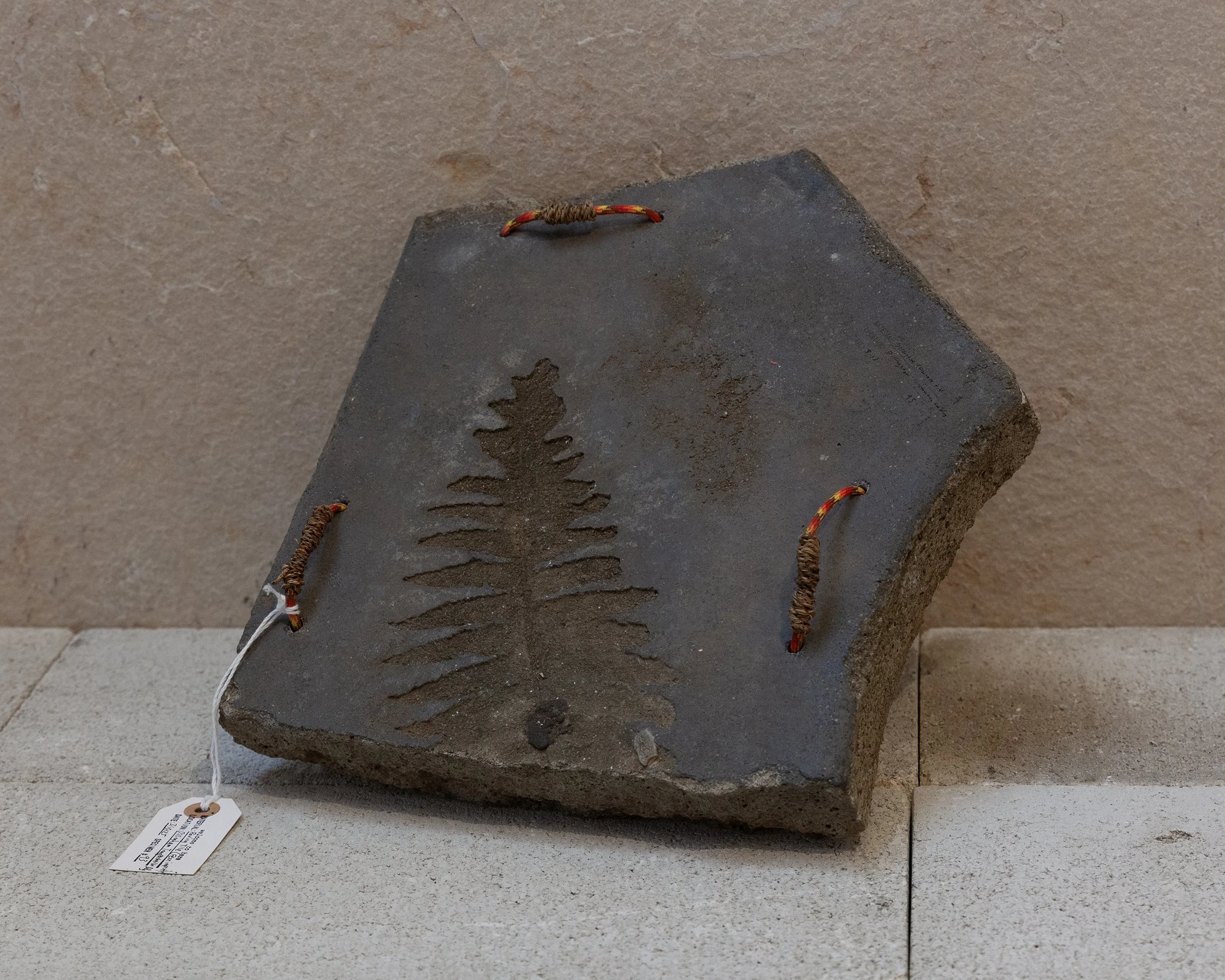   #93.106   Paving Tile from Waikahalulu / the Dillingham Transportation Building, niu (coconut fiber) from Puʻuloa / Pearl Harbor, paracord  11 x 12 x 3 in. 