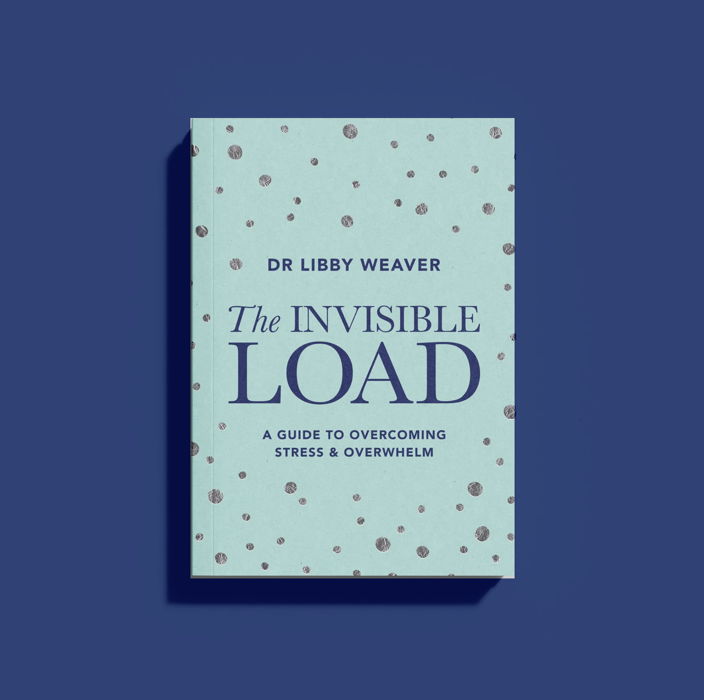 A book titled 'The Invisible Load' by Dr. Libby Weaver, with a light blue cover featuring scattered dark gray dots, on a blue background.