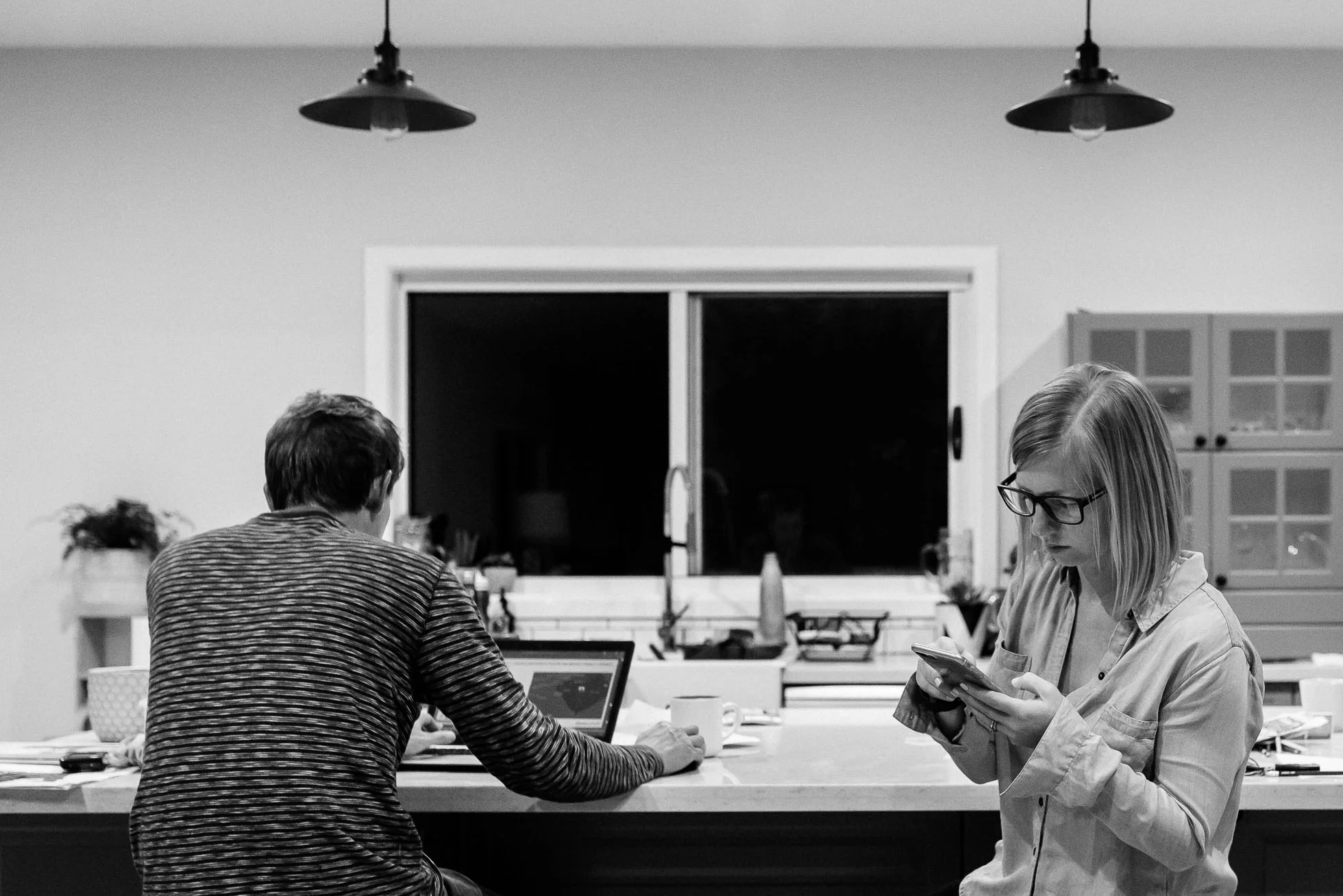 self-portrait-couple-working-together-at-counter-on-technology-black-and-white-photography.jpg