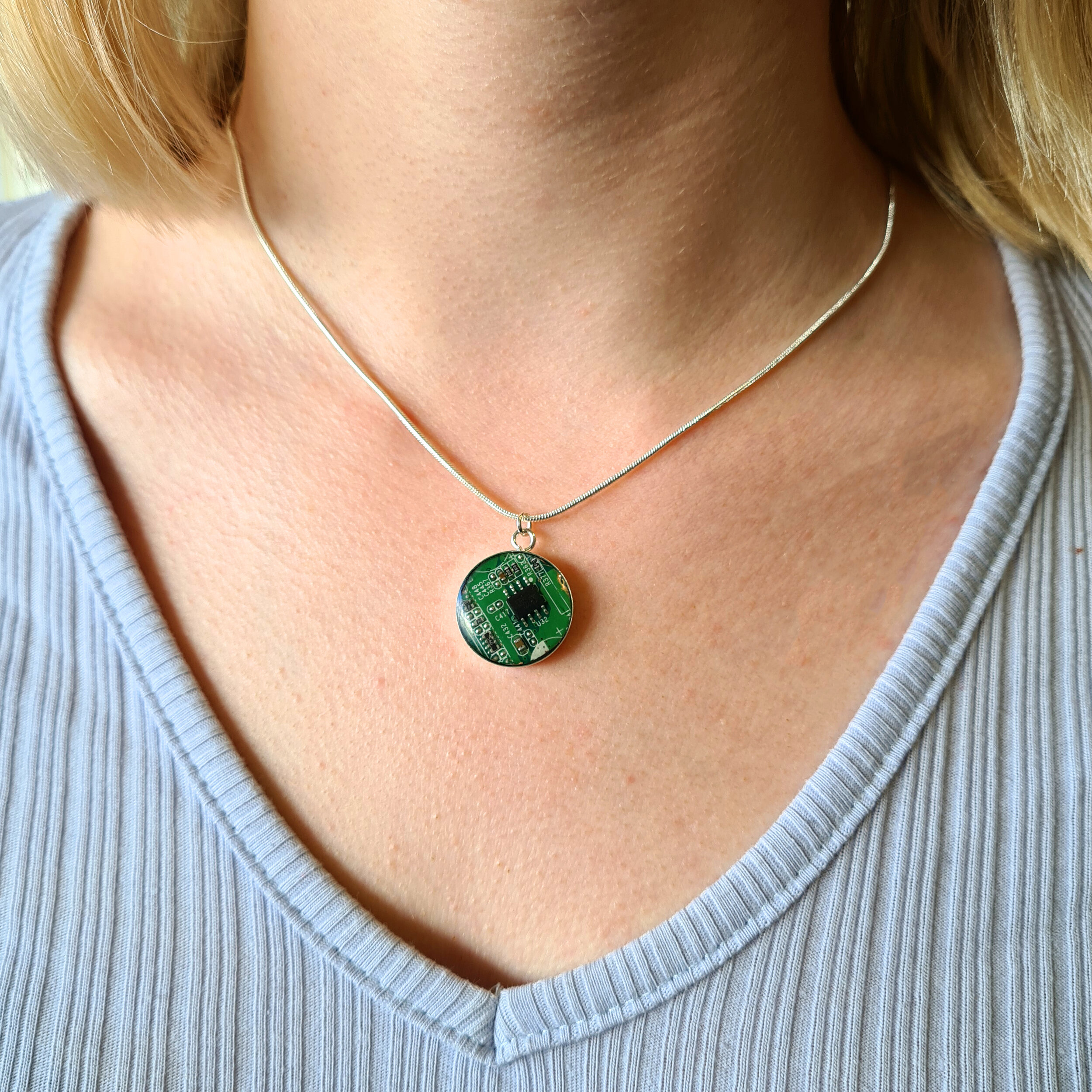 Green necklace on neck 