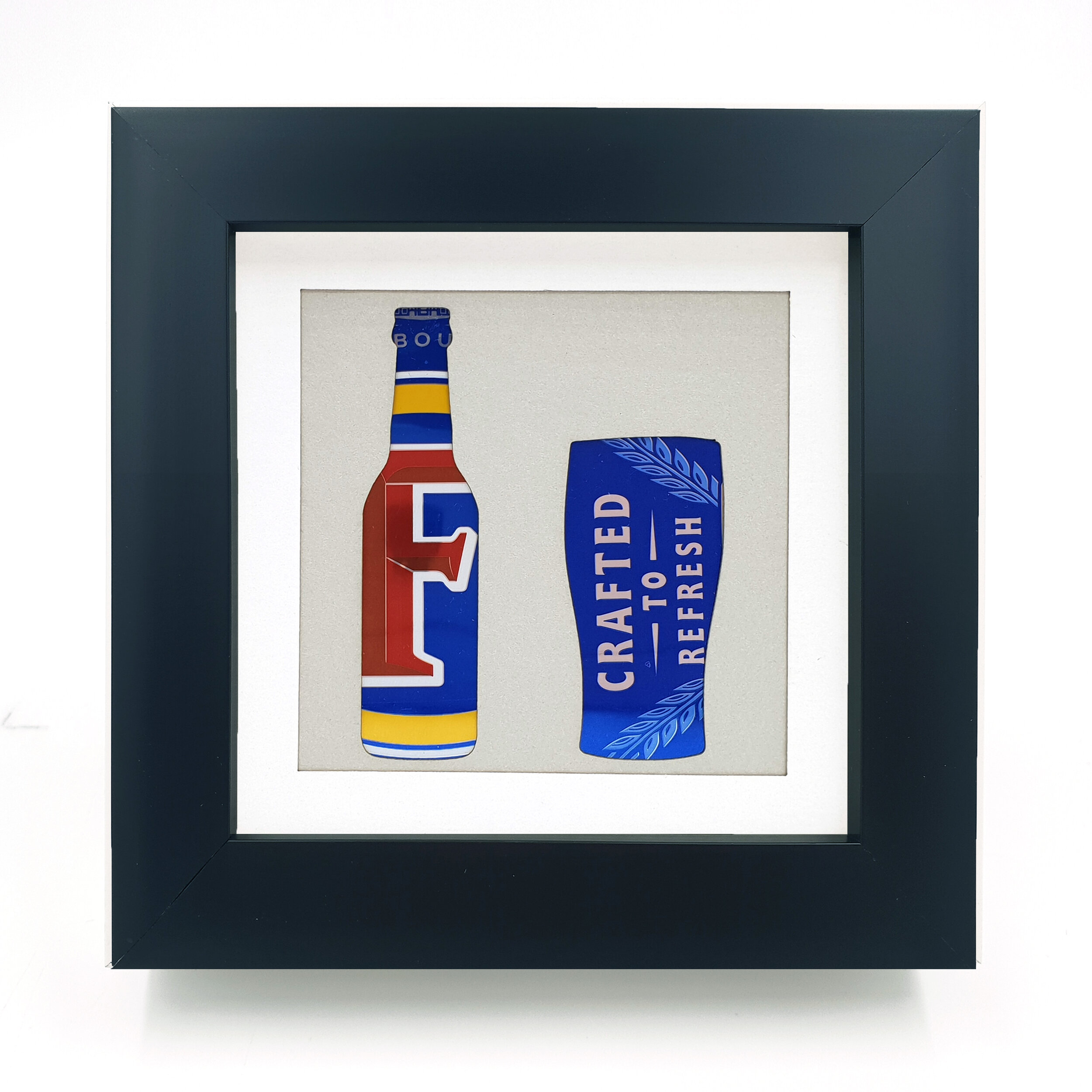 Blue yellow and red bottle upcycled can art black frame