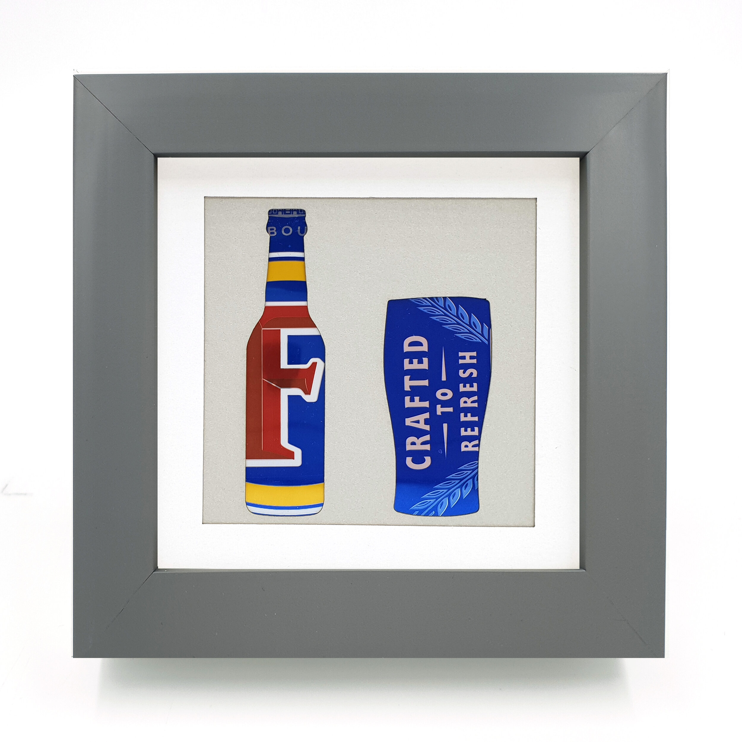 Blue yellow and red bottle upcycled can art  grey frame