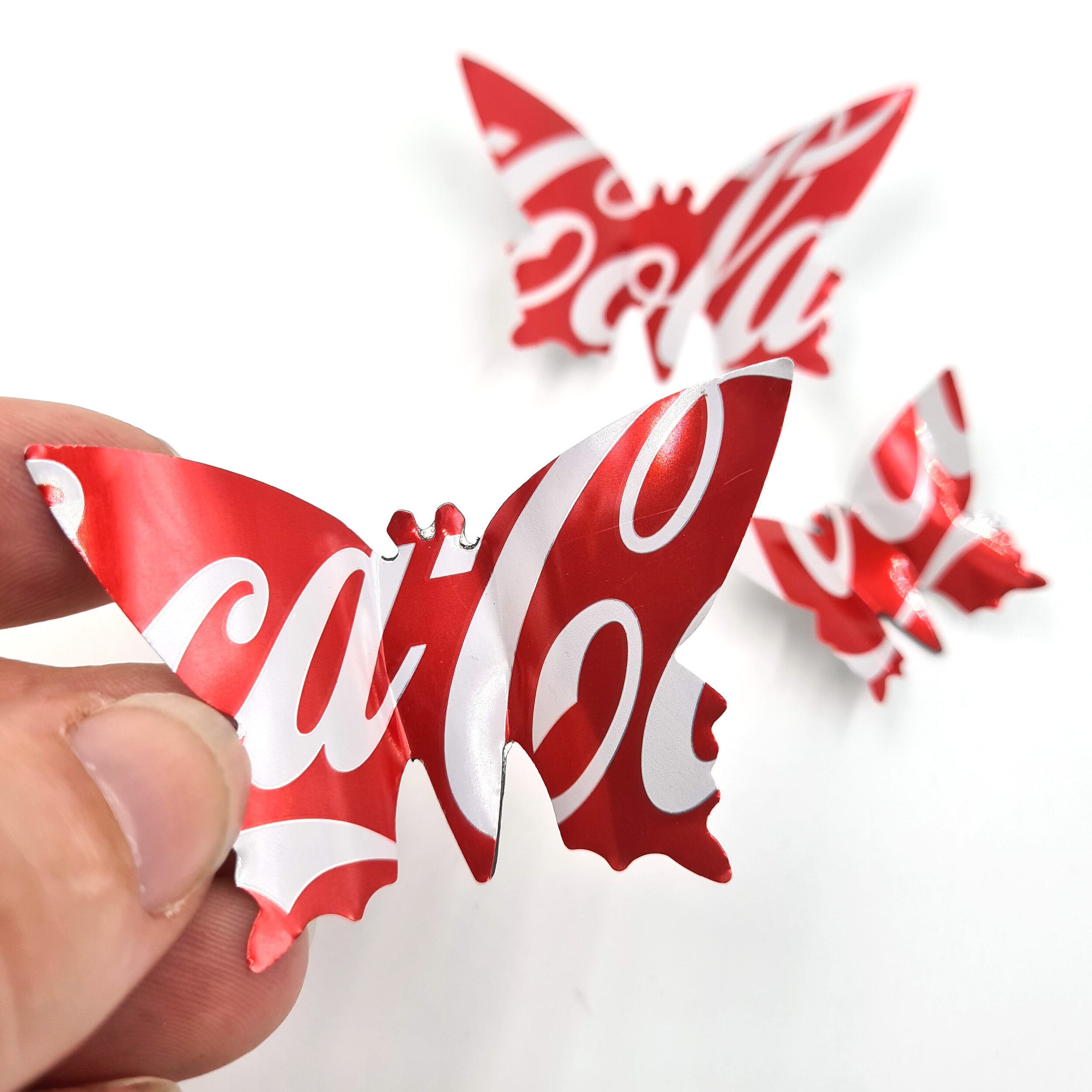 Coca-Cola Butterfly upcycled Can Magnets holding