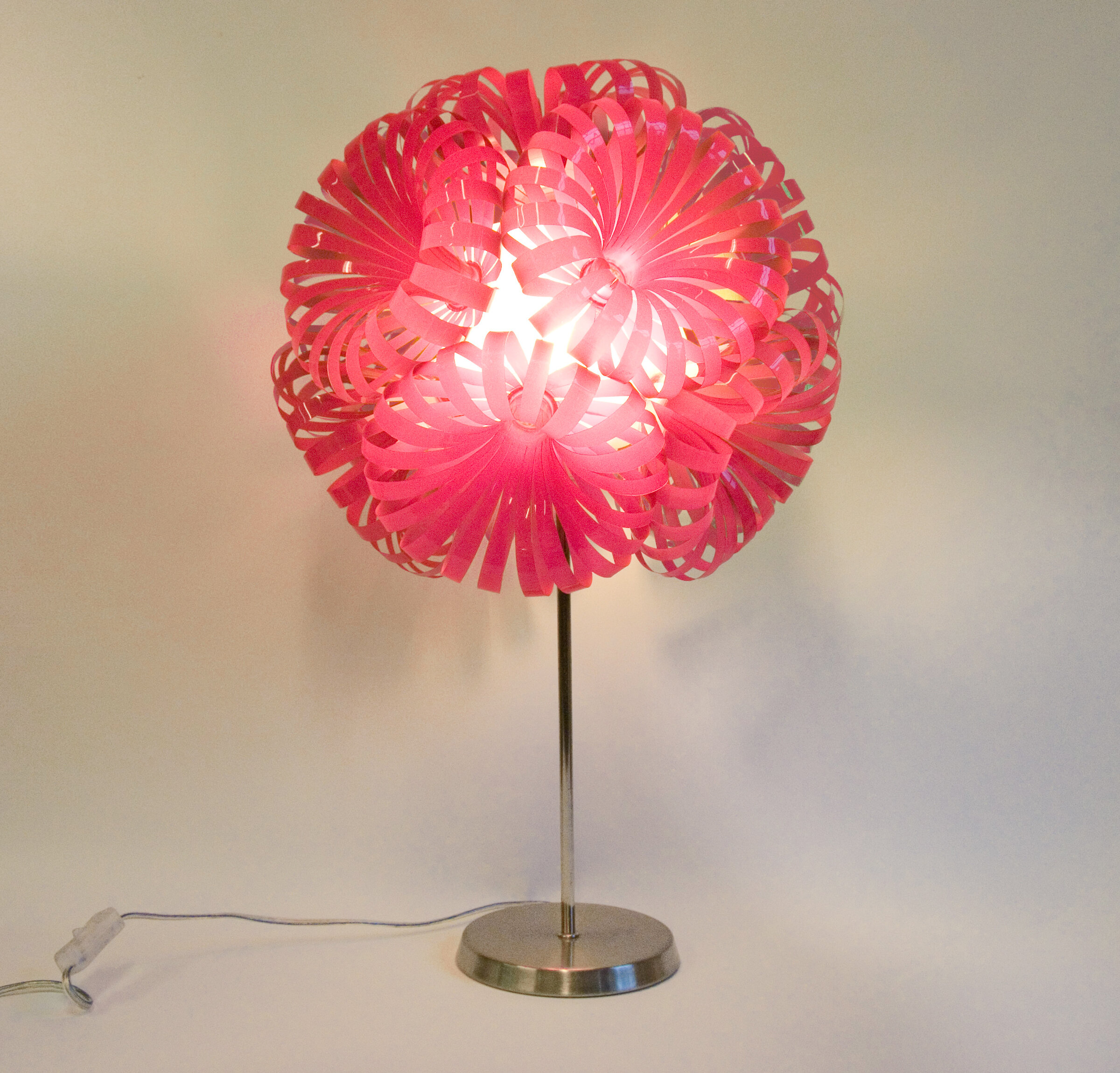Repurposed pink lamp using an energy saving bulb