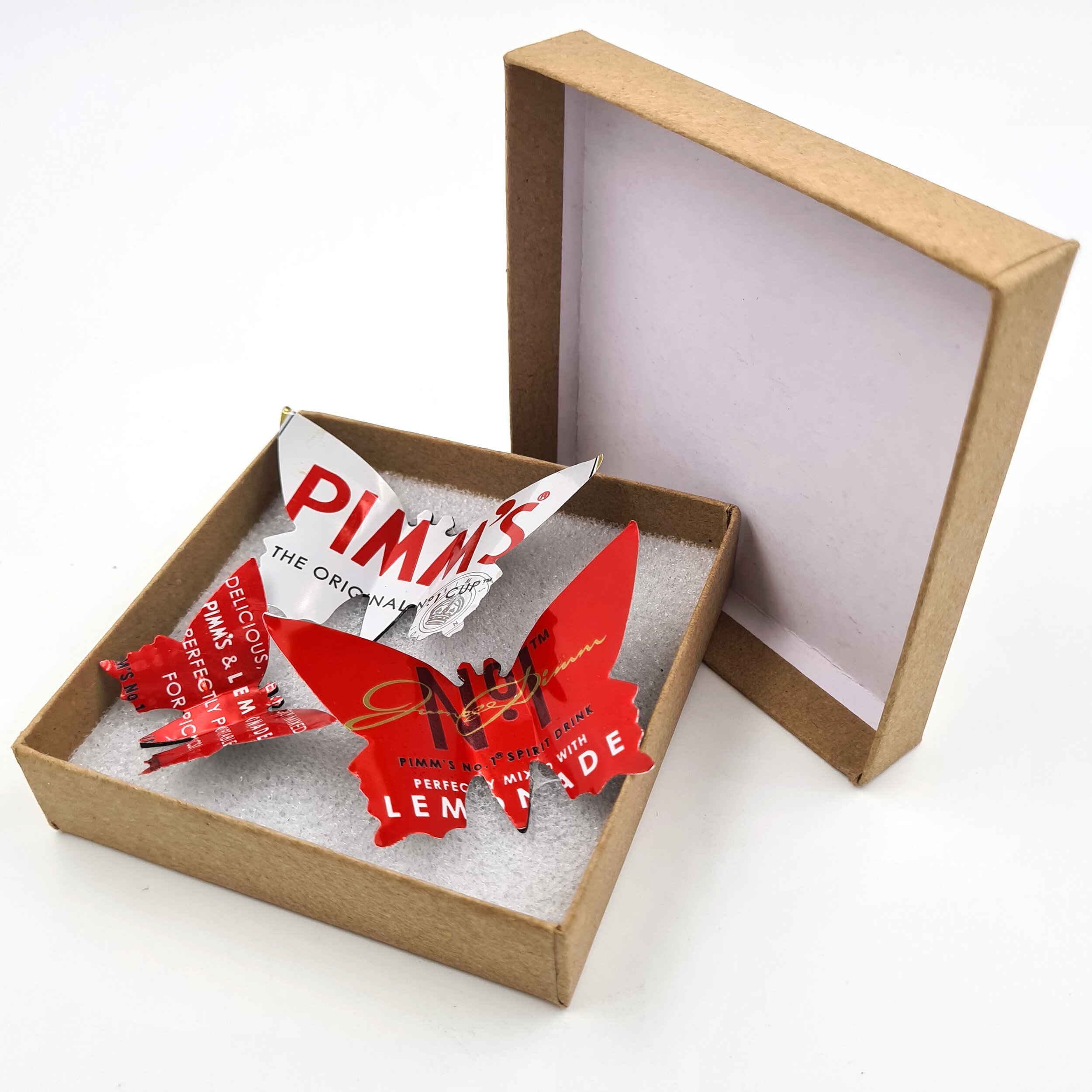 Pimm's red and white eco Butterfly Can Magnets in box