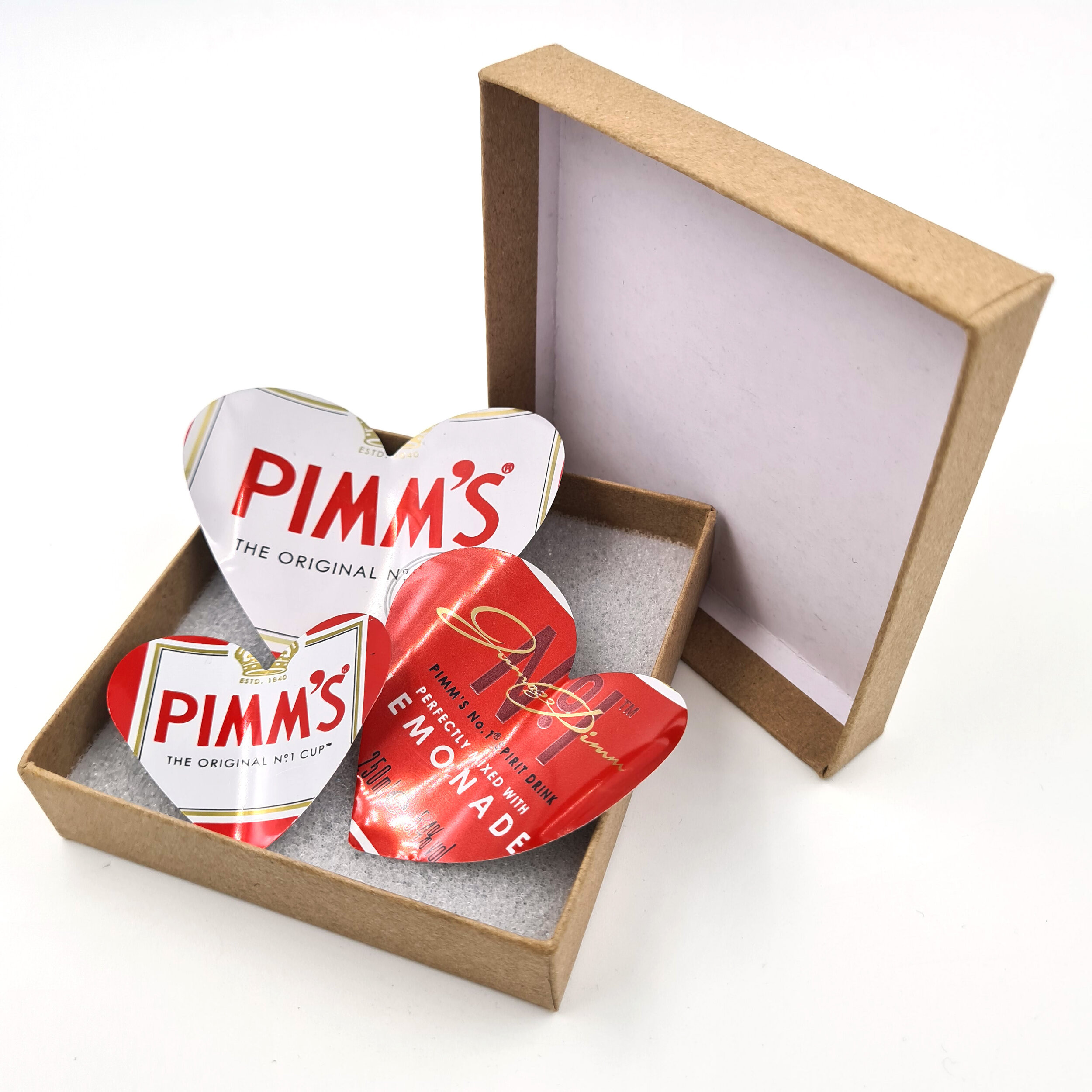 Red and white sustainable Pimm's Heart Can Magnets in box 